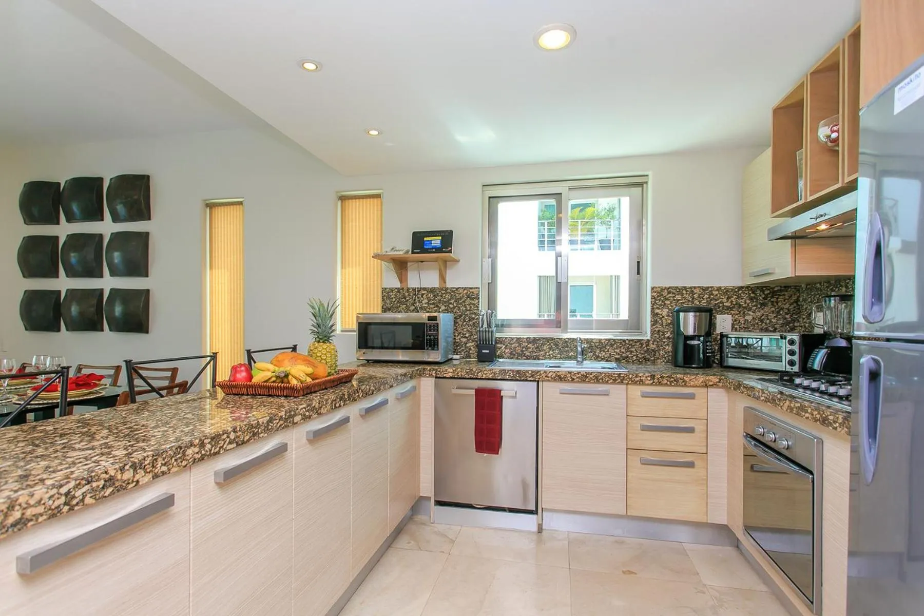 Kitchen or kitchenette in 3-Level Condo with a Private Balcony & Rooftop Lounge