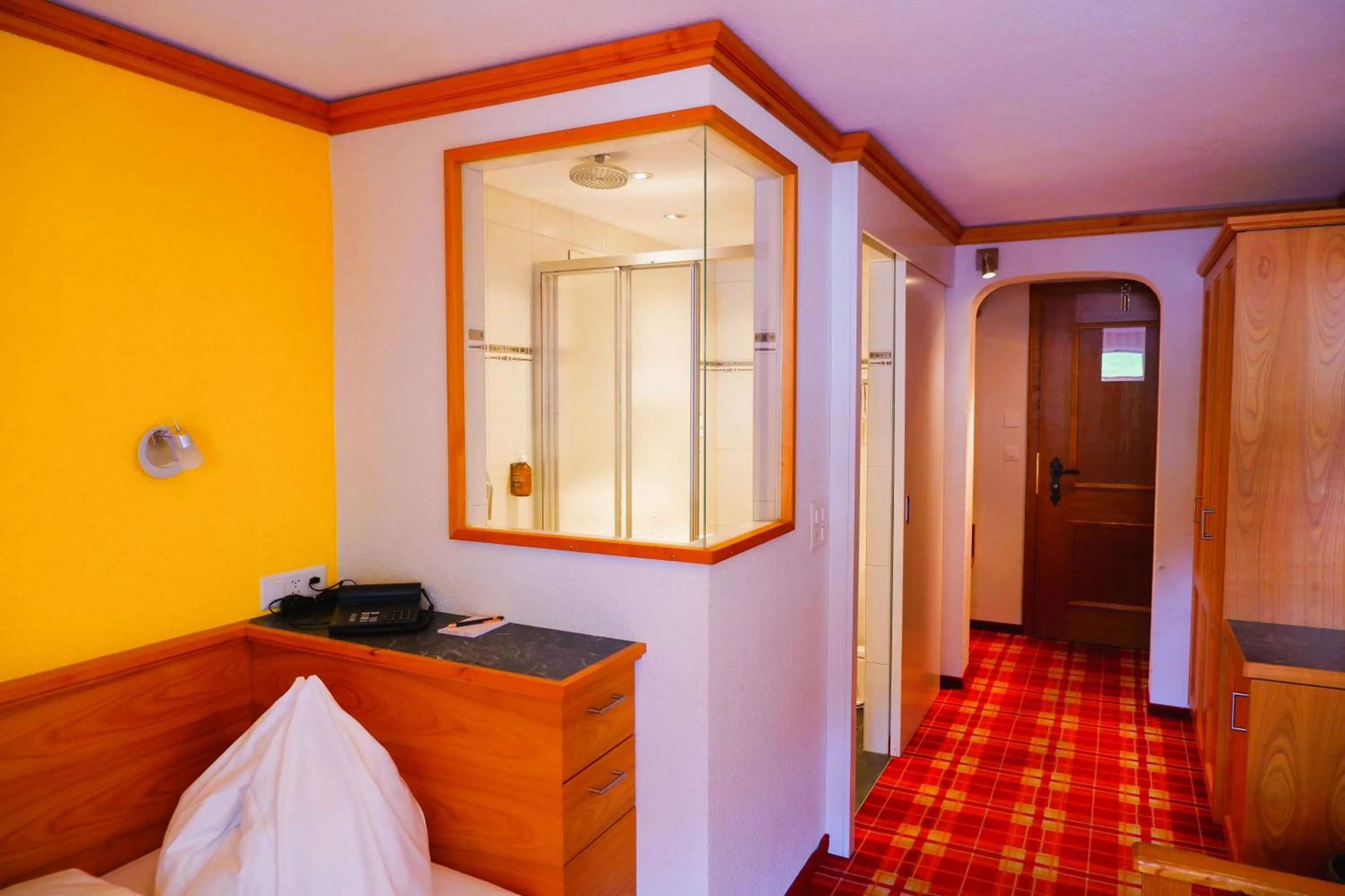 Bed in Hotel Christiania Saas-Fee