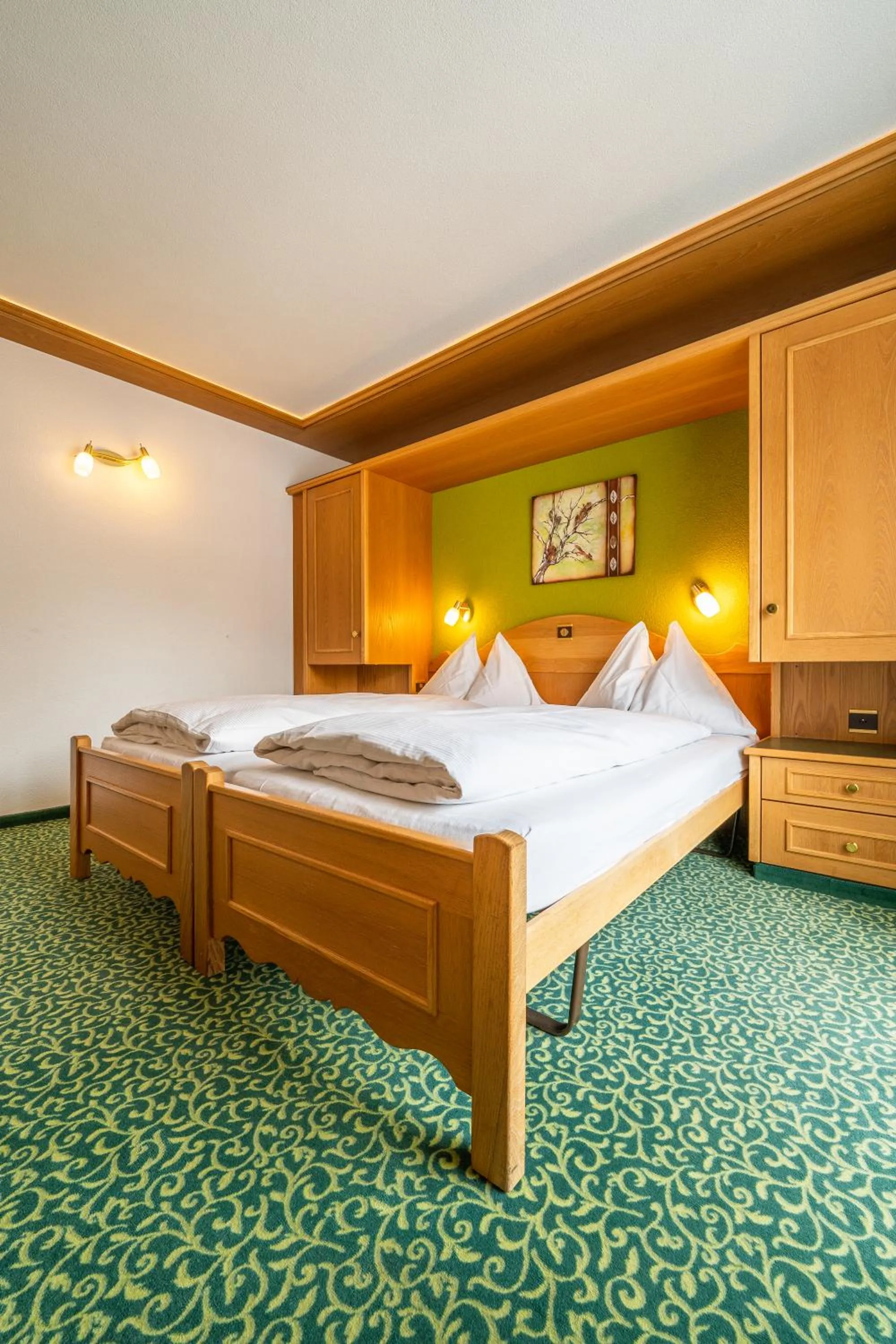 Bed in Hotel Christiania Saas-Fee