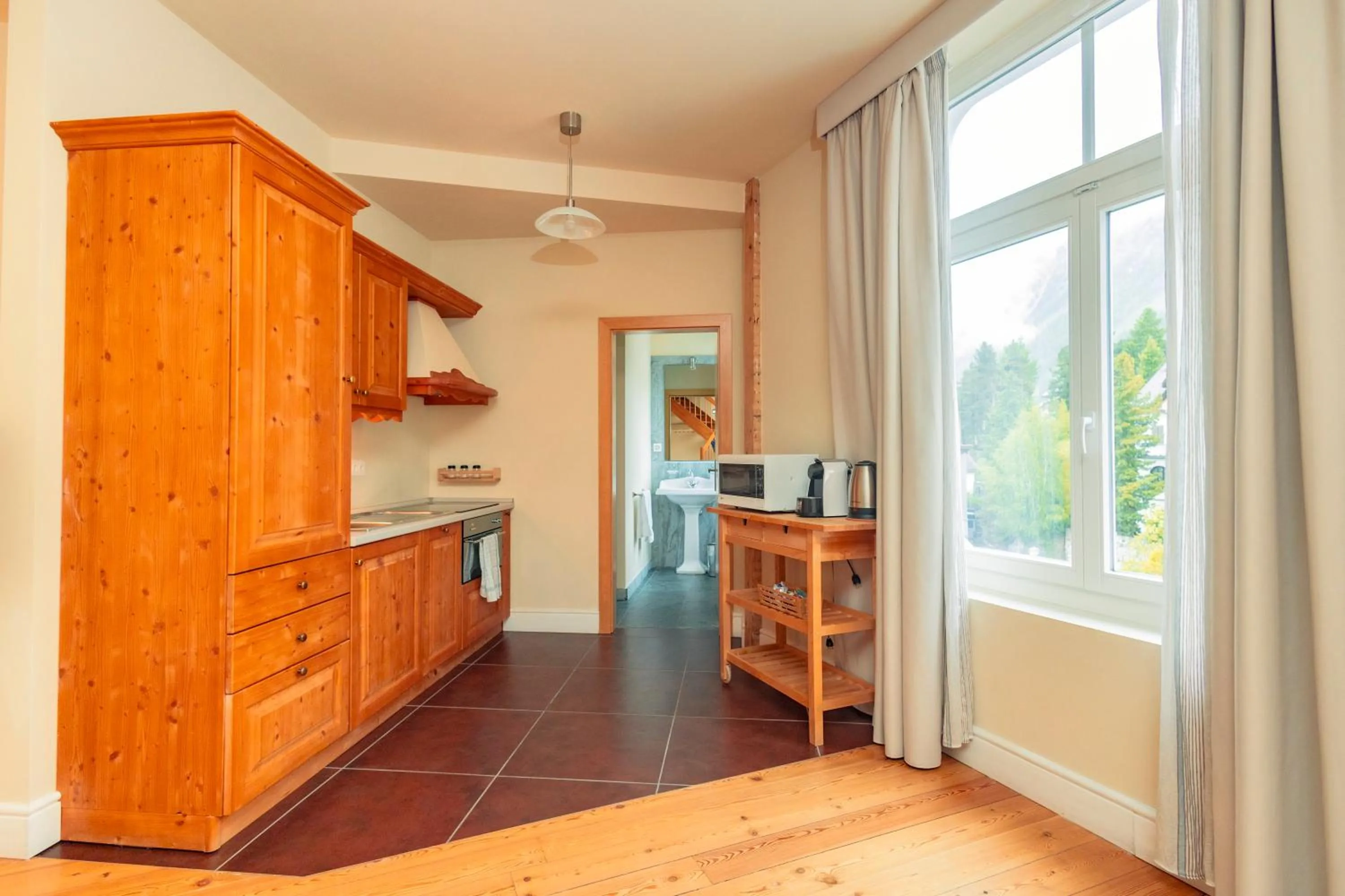 Kitchen or kitchenette in Hotel Bernina 1865 by Kleos Group Collection