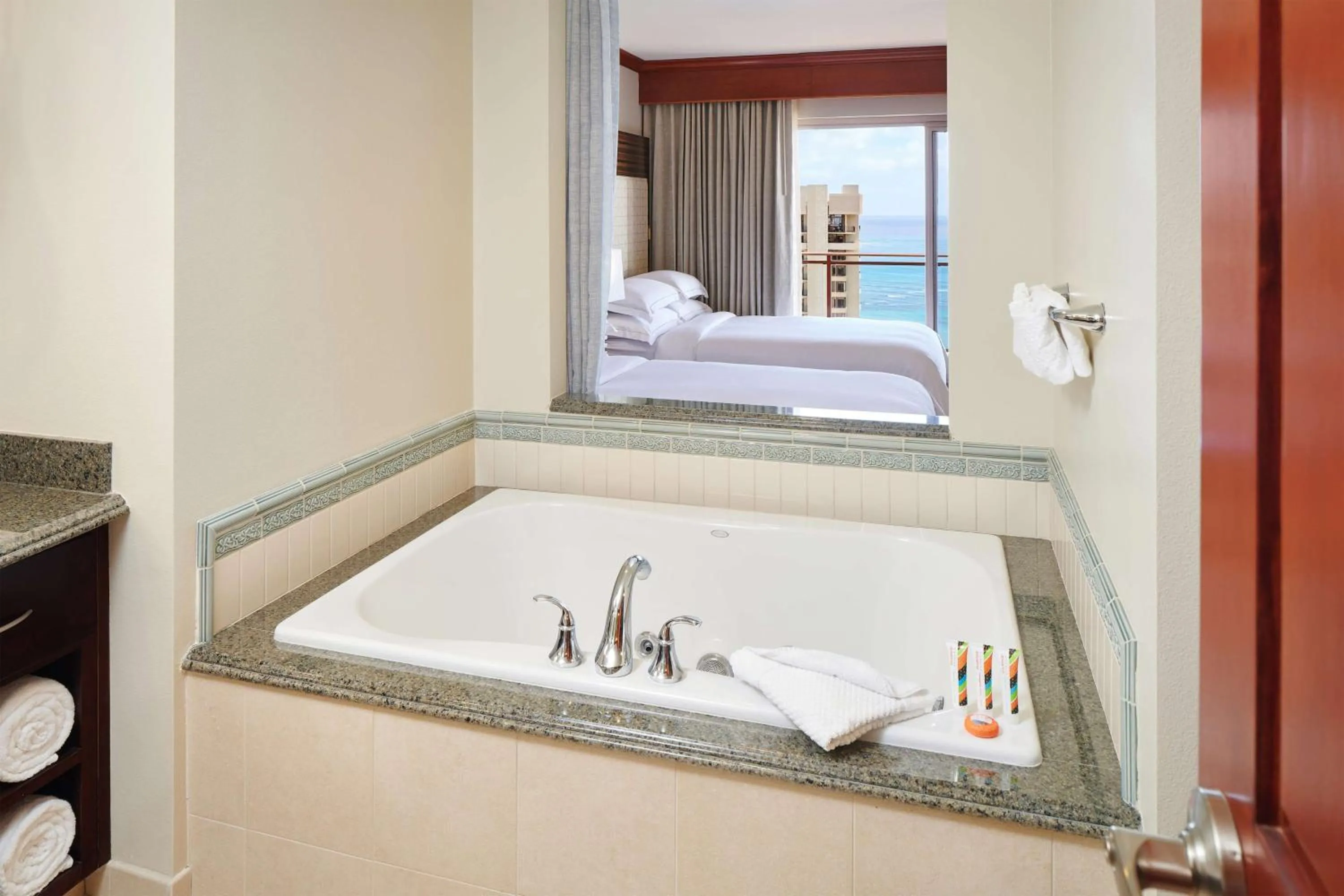 Bathroom, Bed in Hilton Grand Vacations Club Grand Waikikian Honolulu