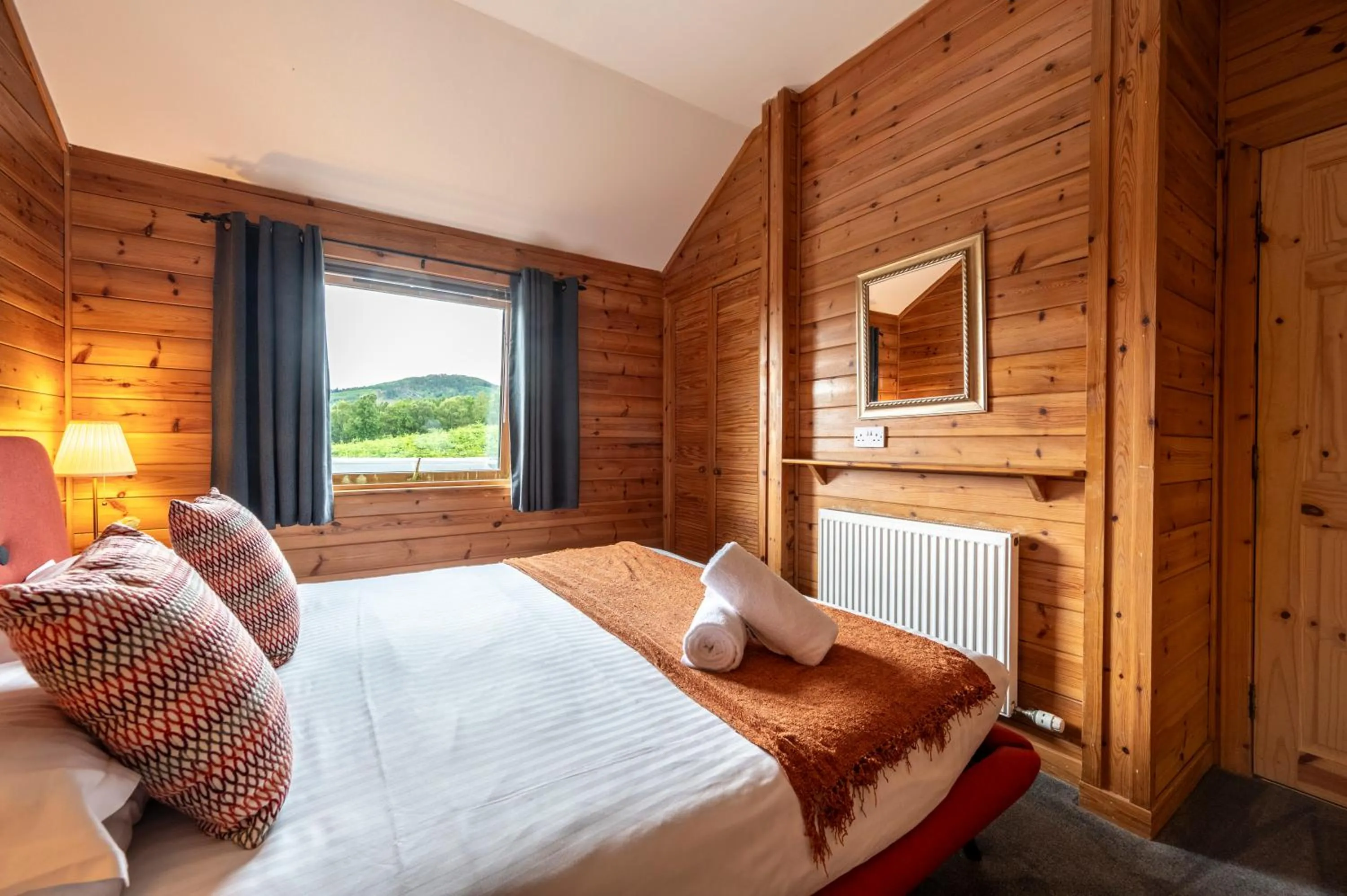 Bed in Kinnaird Woodland Lodges