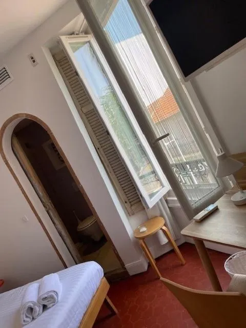 Bed in Hôtel de la Pinède