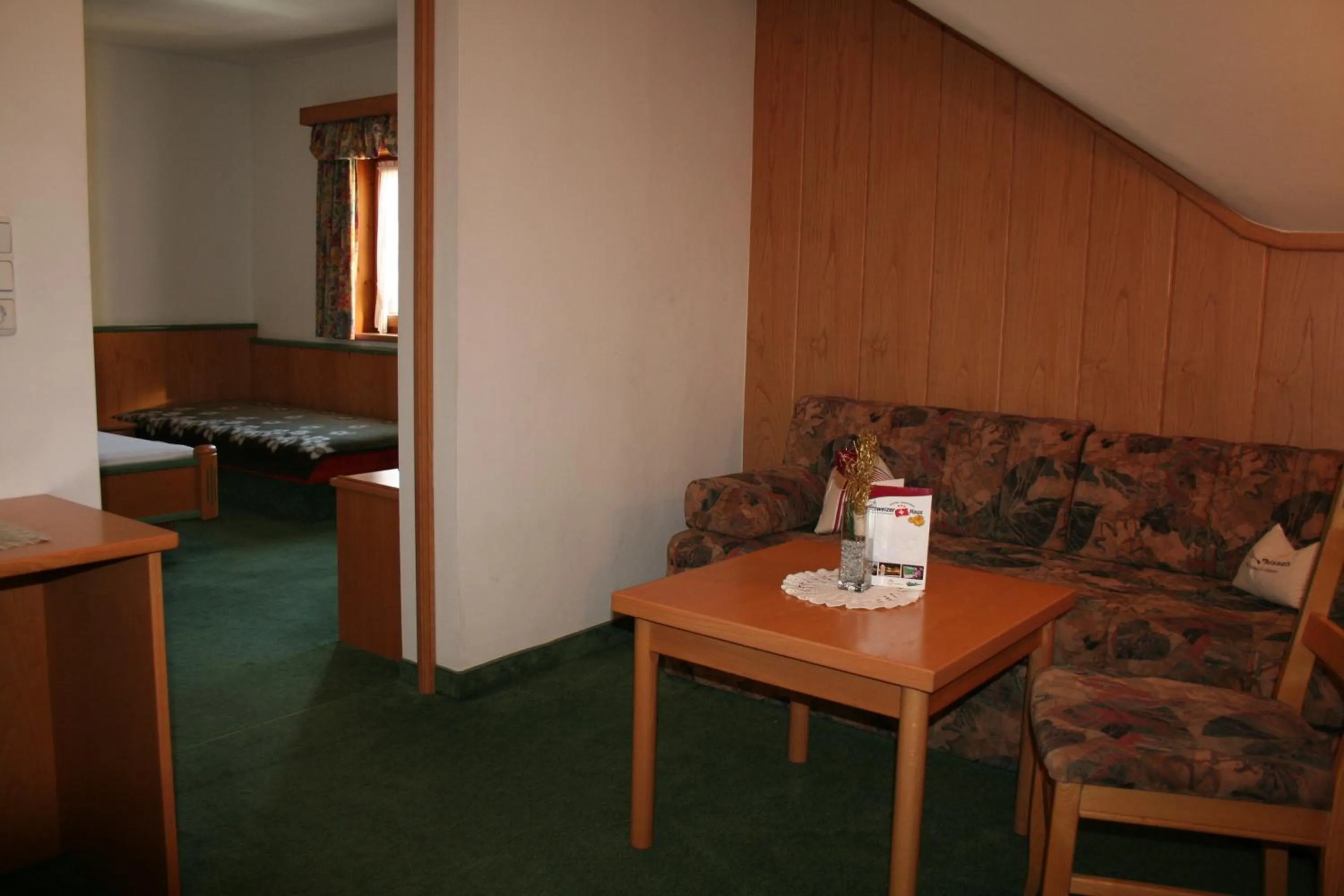 Living room, Bed in Hotel Gasthof Schweizerhaus