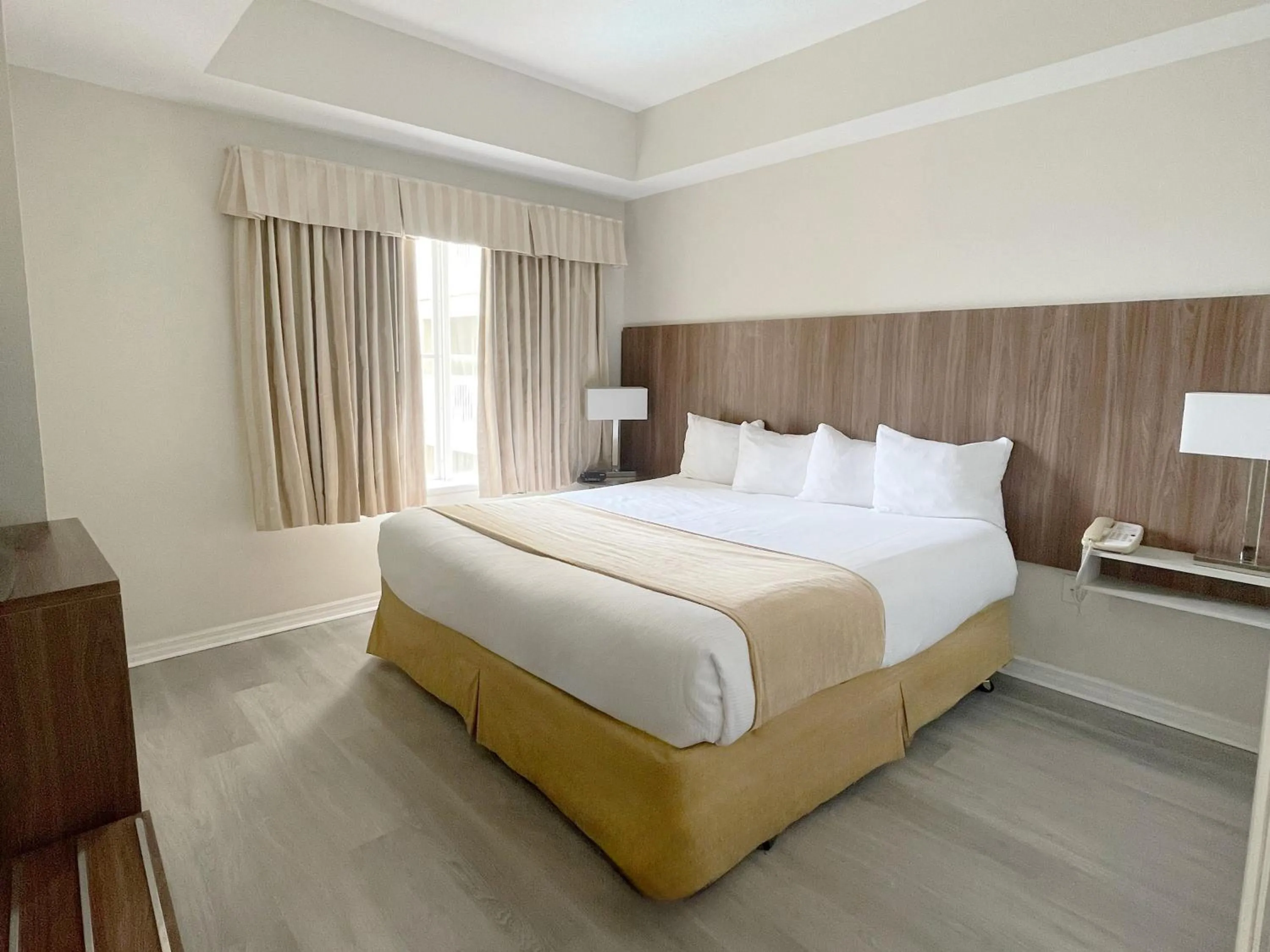Bed in The Point Hotel & Suites Universal