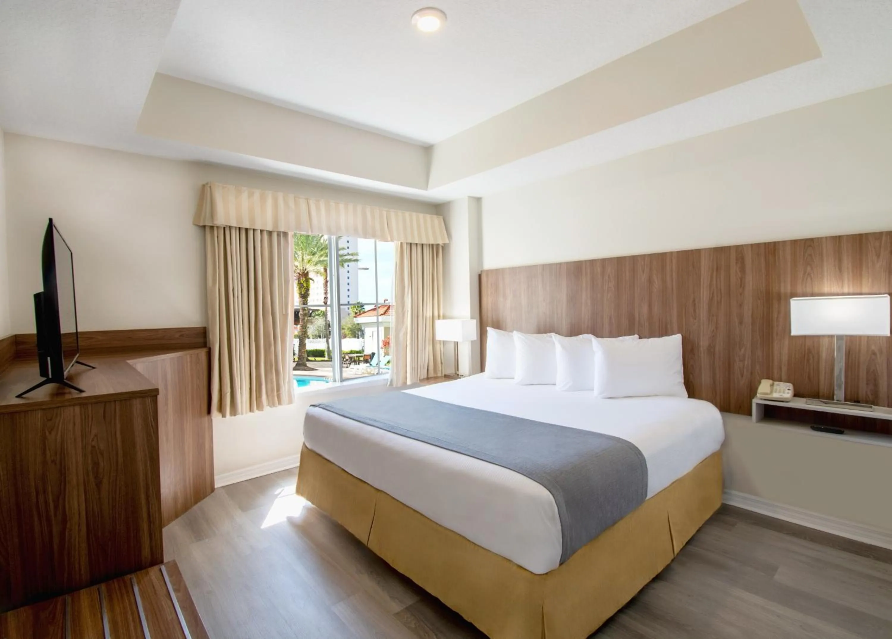 Bed in The Point Hotel & Suites Universal