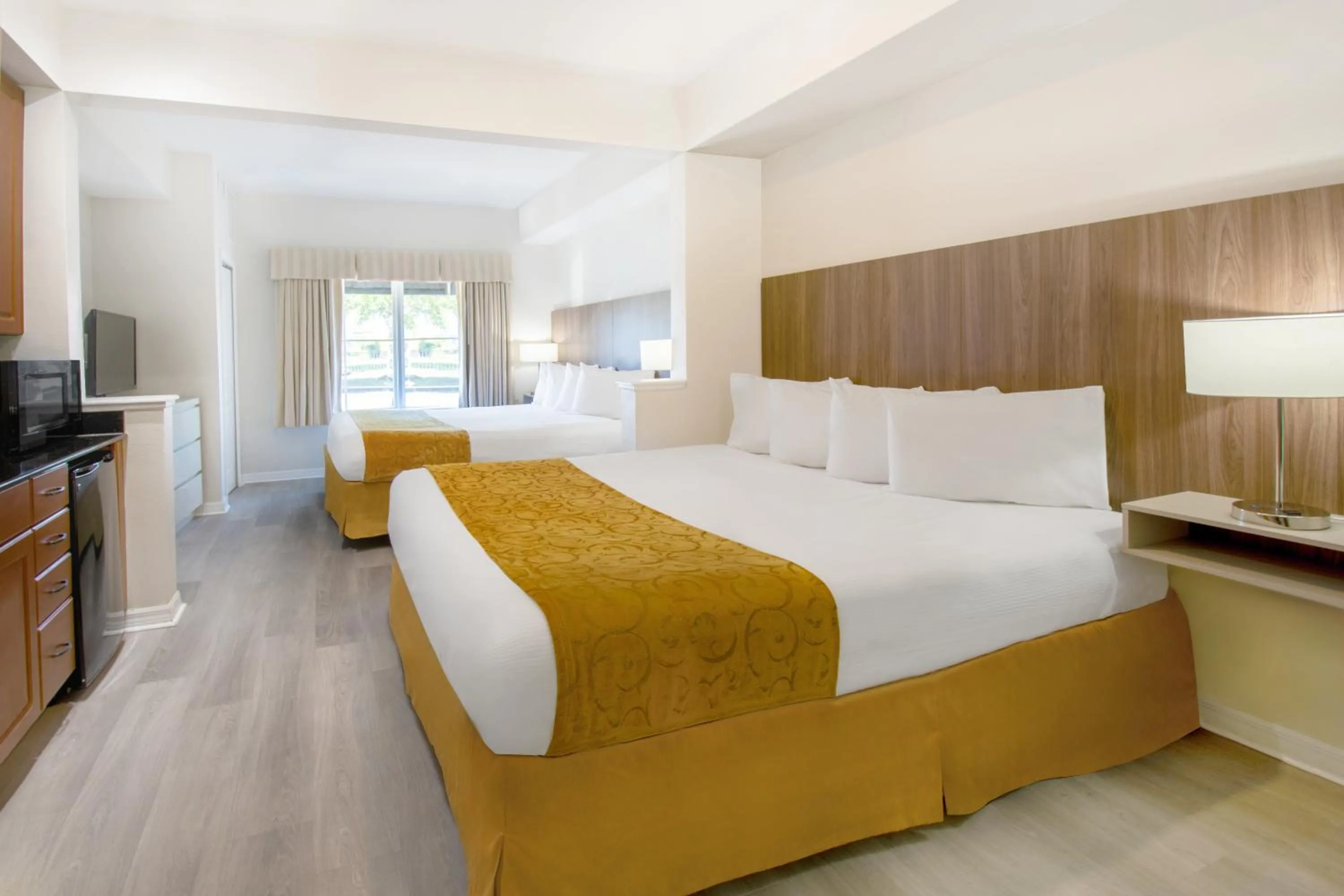 Bed in The Point Hotel & Suites Universal