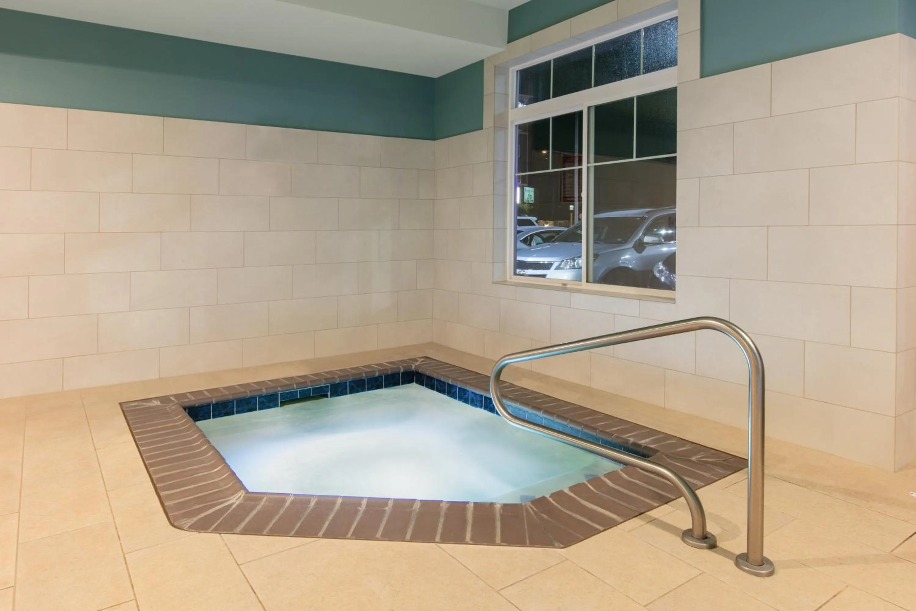 Swimming pool in Holiday Inn Express Hotel & Suites Seaside Convention Center by IHG
