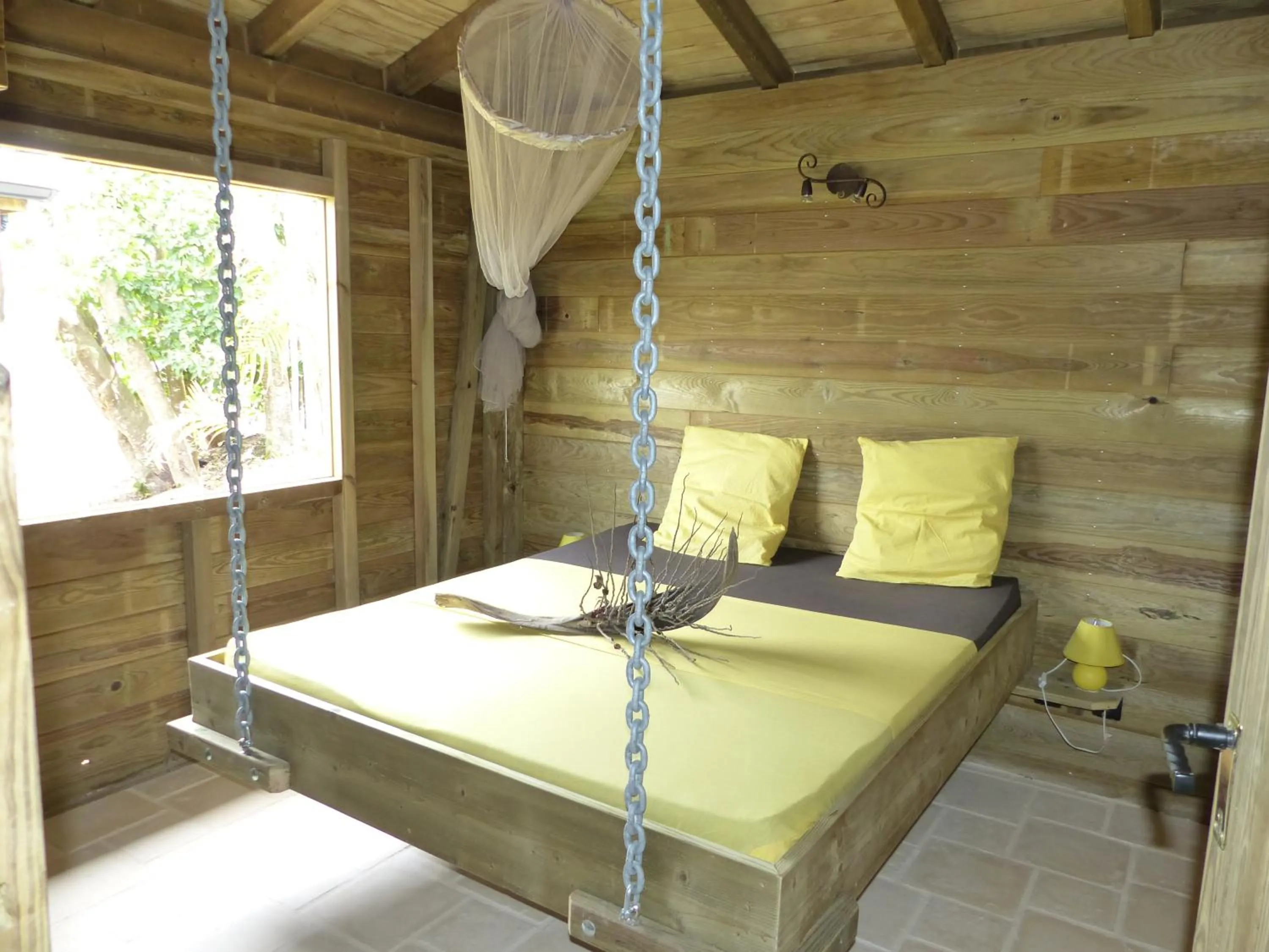 Bed in Iguana Ecolodge
