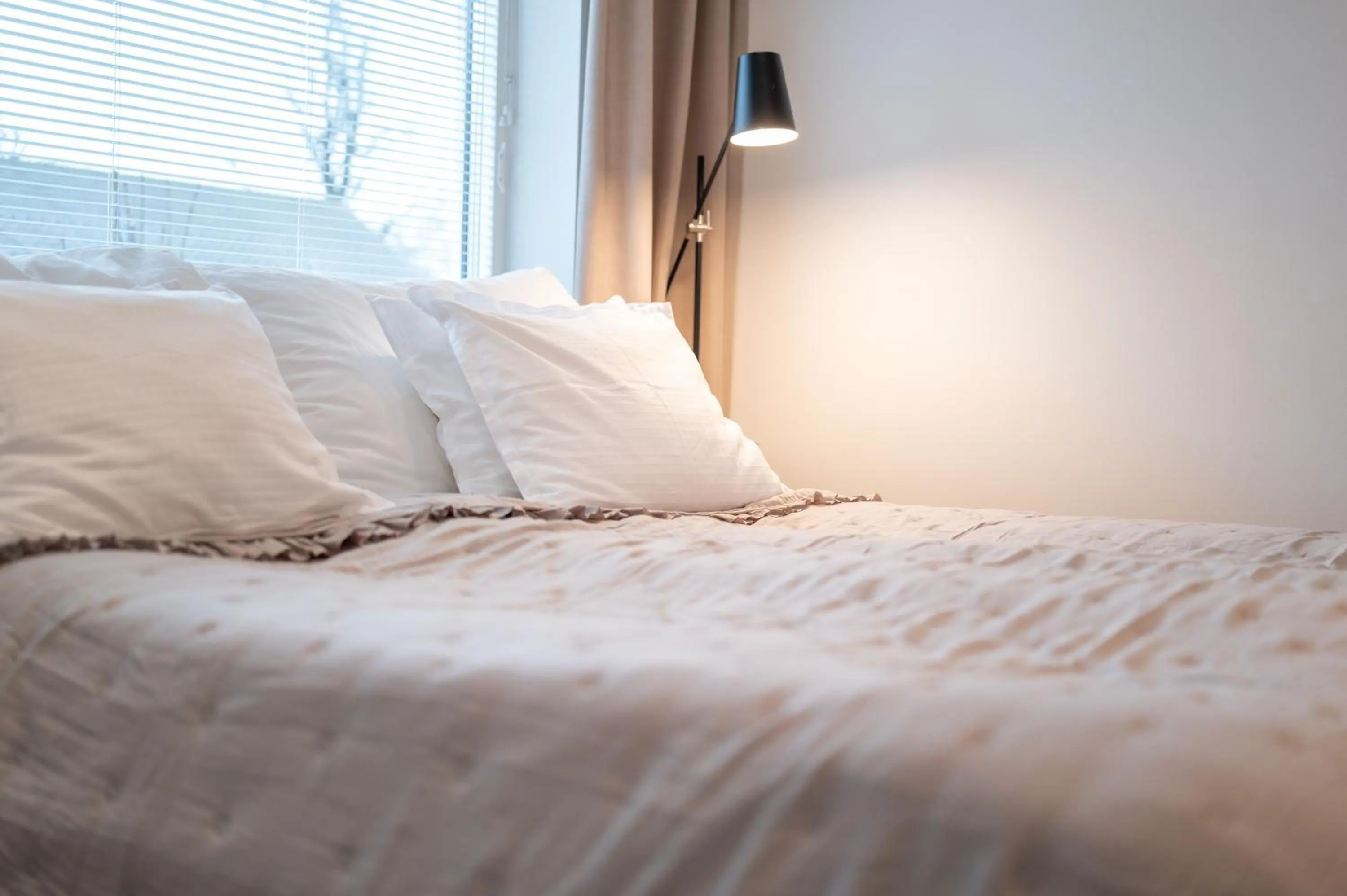 Bed in Easy Livin' Apartment Hotel