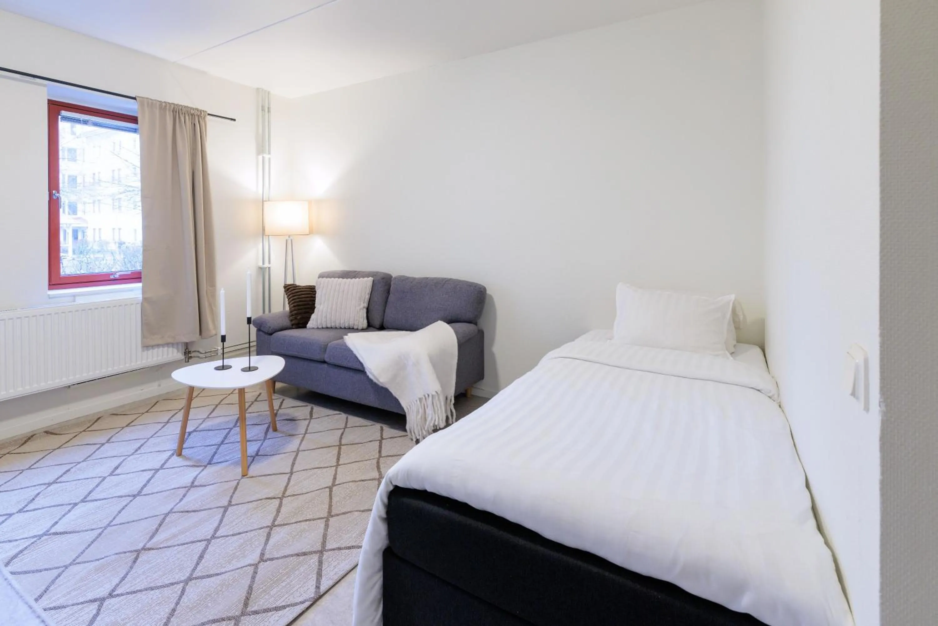 Bed in Easy Livin' Apartment Hotel