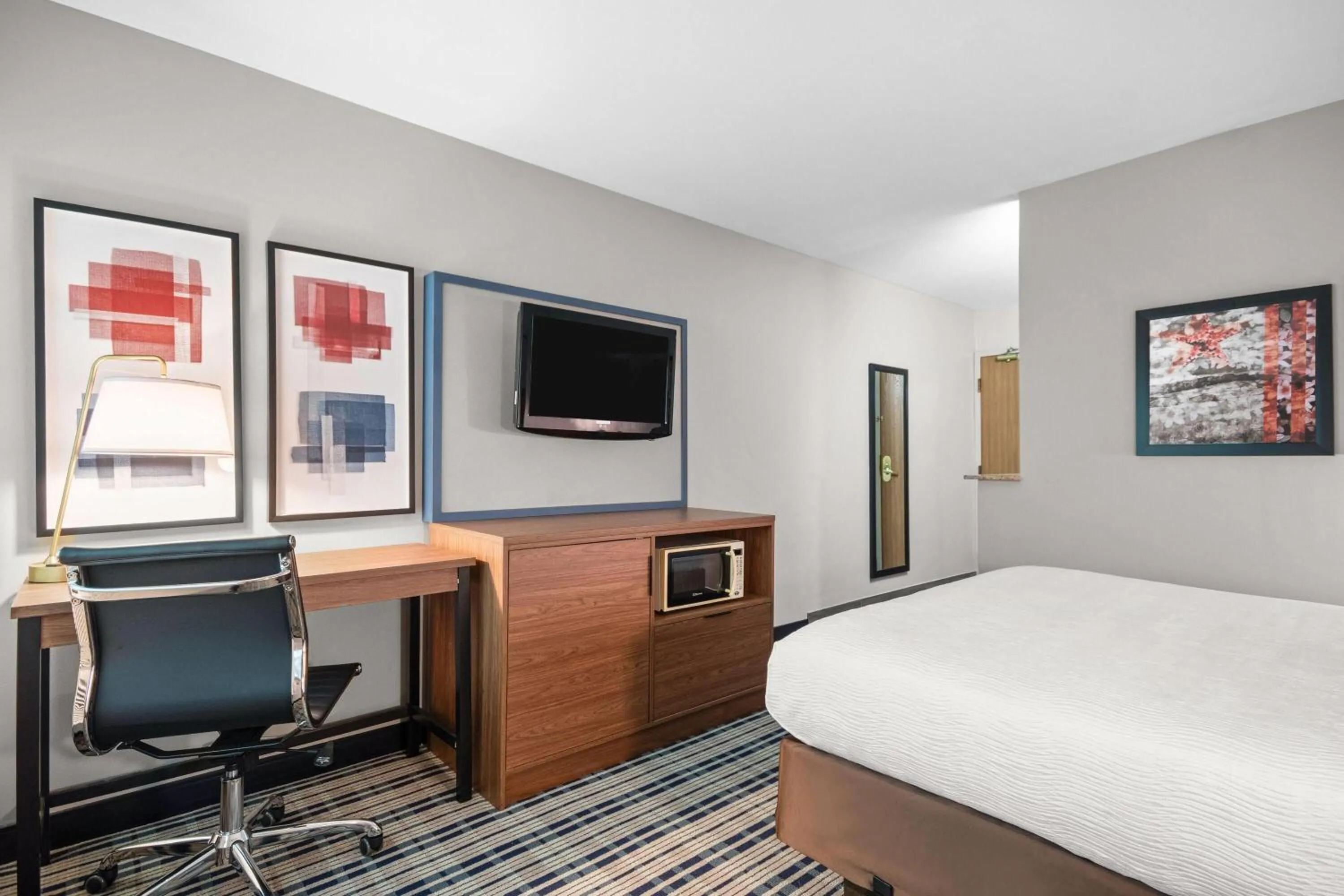 Bed in AmericInn by Wyndham Beloit