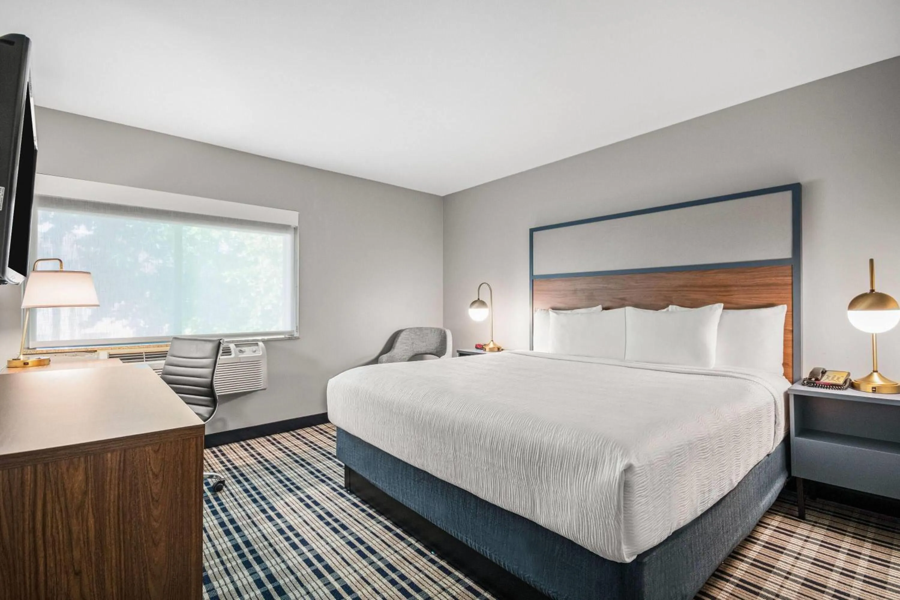 Bed in AmericInn by Wyndham Beloit