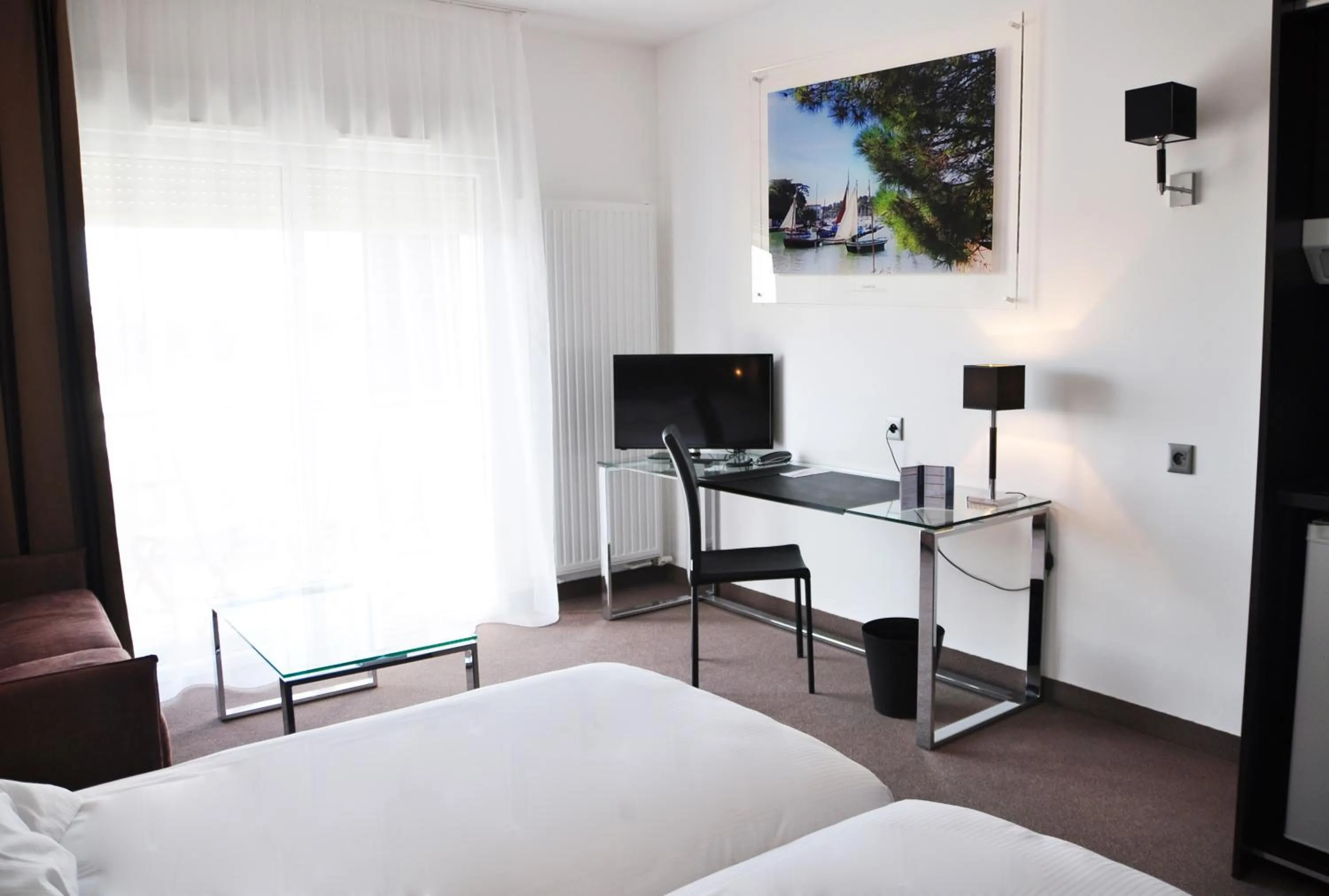 Bed in Golden Tulip Pornic Suites- Appart Hotel