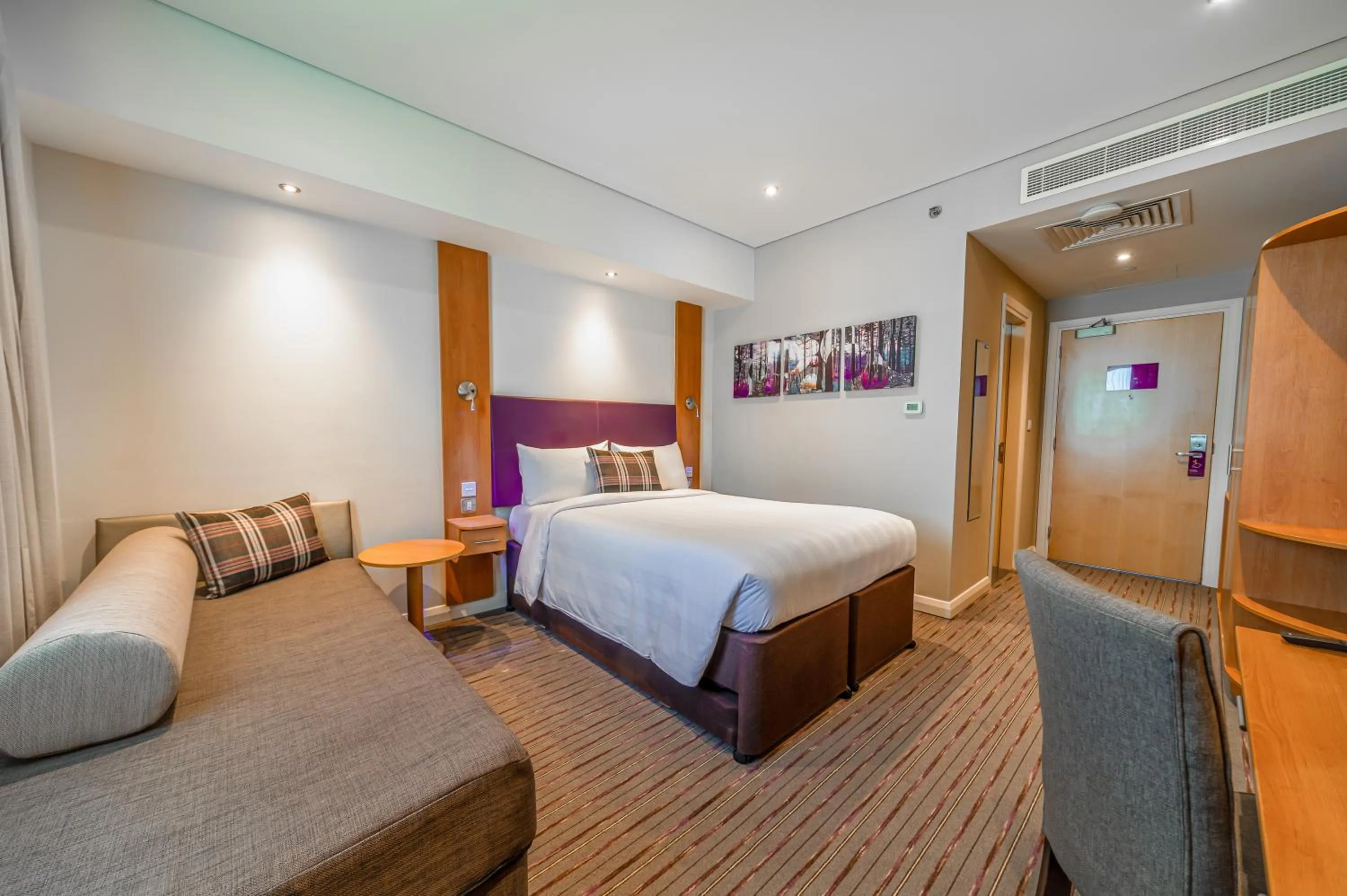 Seating area, Bed in Premier Inn Dubai Silicon Oasis - An Emirates Group Company