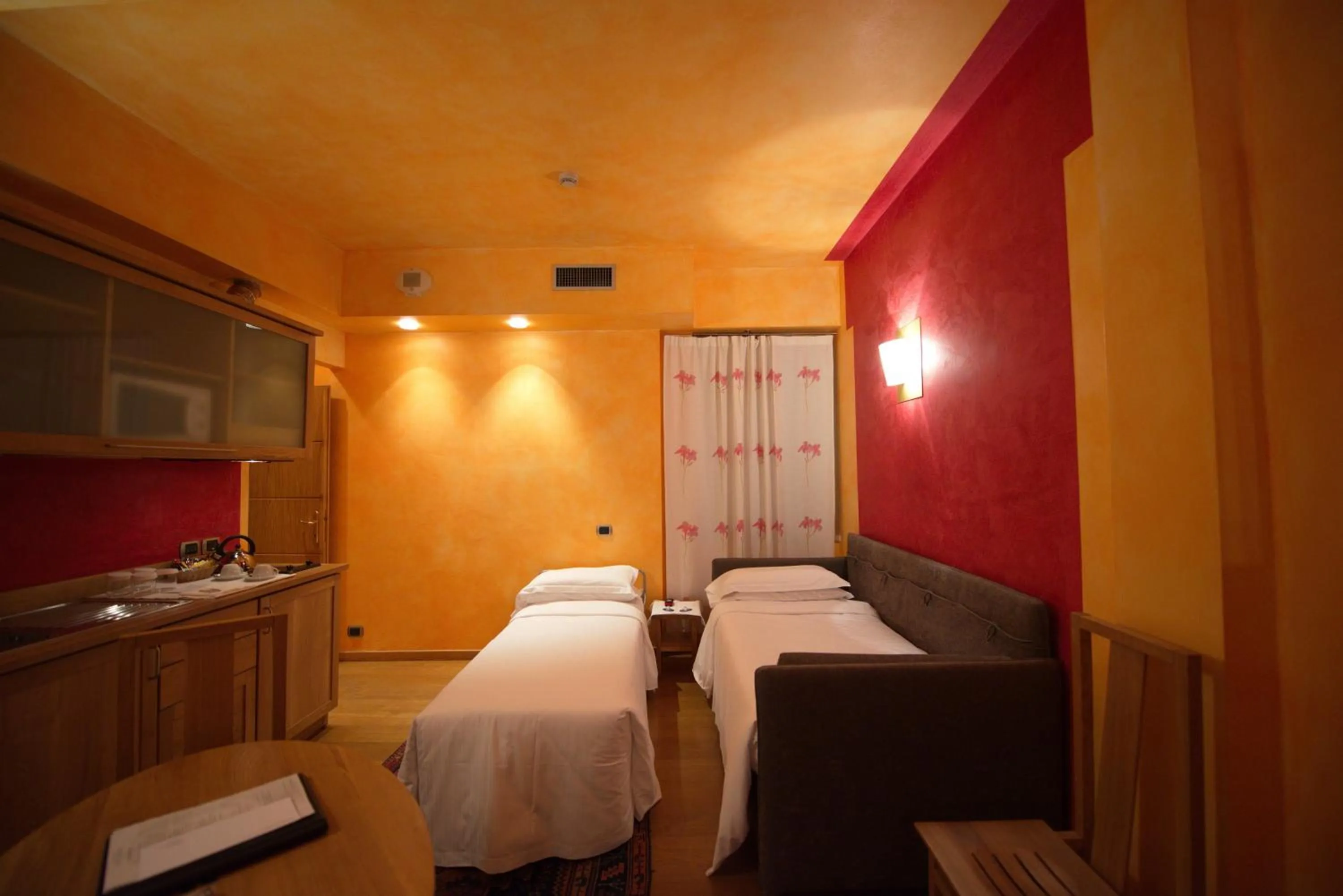 Living room, Bed in Appartamenti Porta Nuova 80