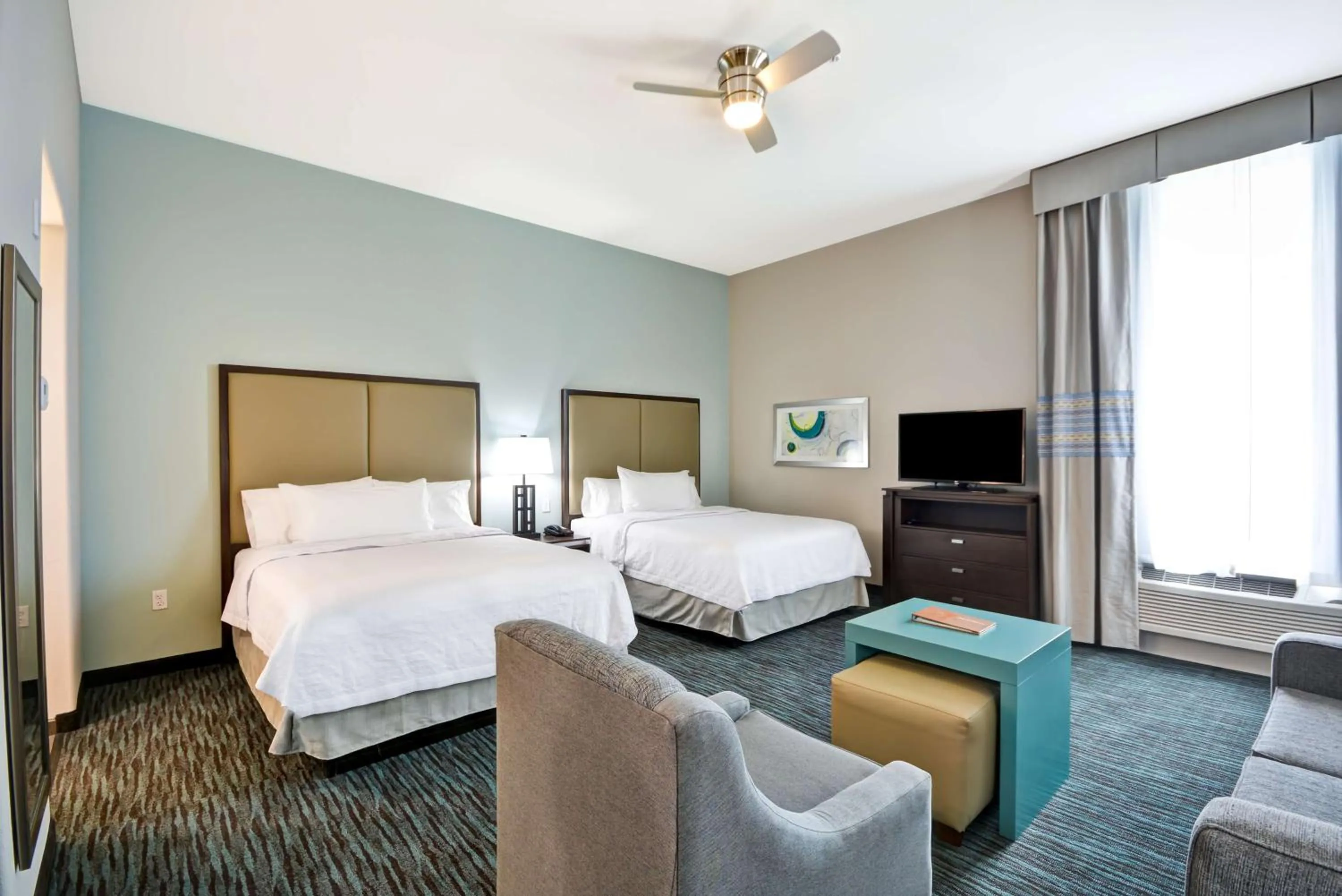 Living room, Bed in Homewood Suites By Hilton Galveston