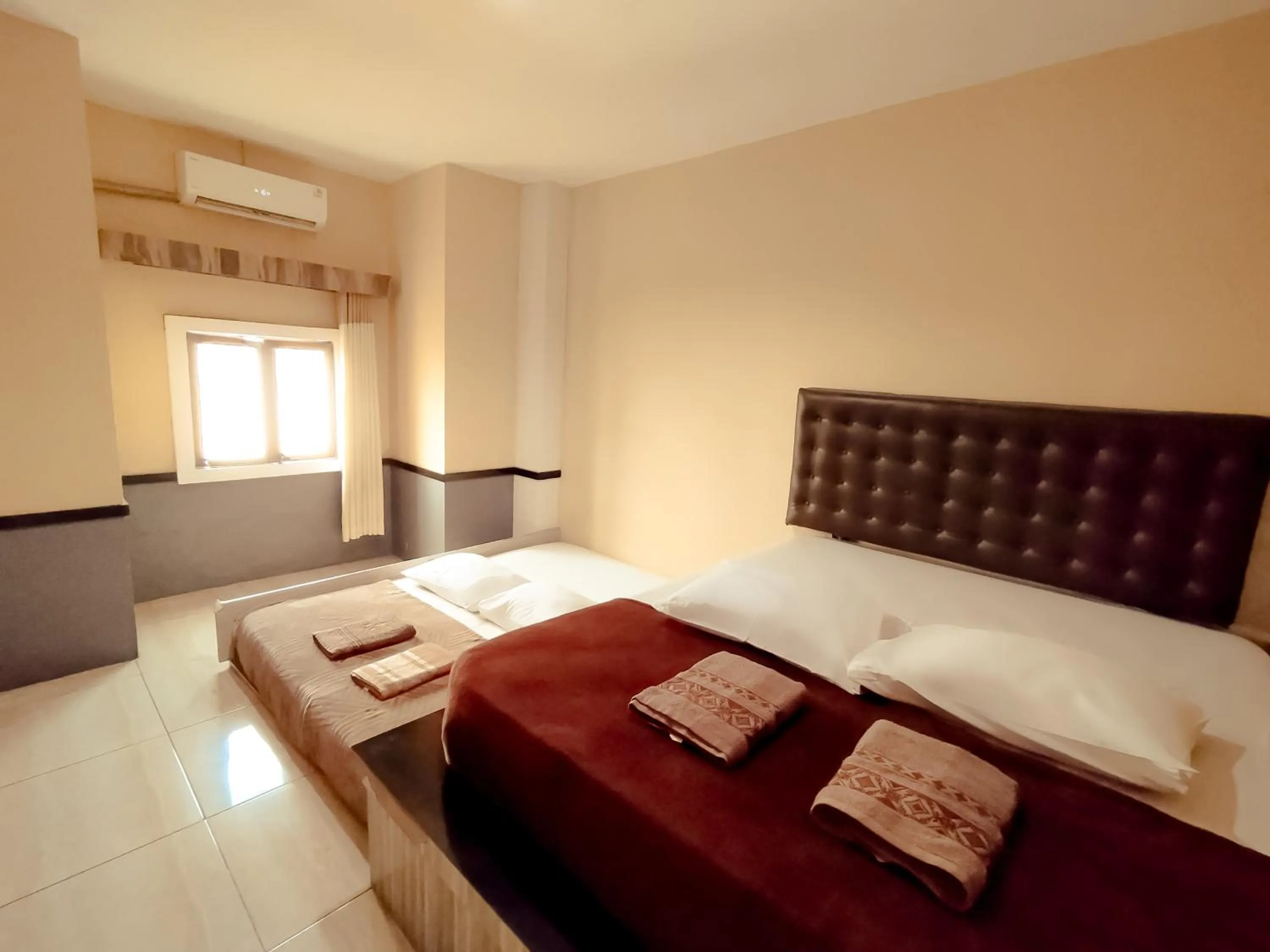 Bed in Hotel Syariah Larismanis