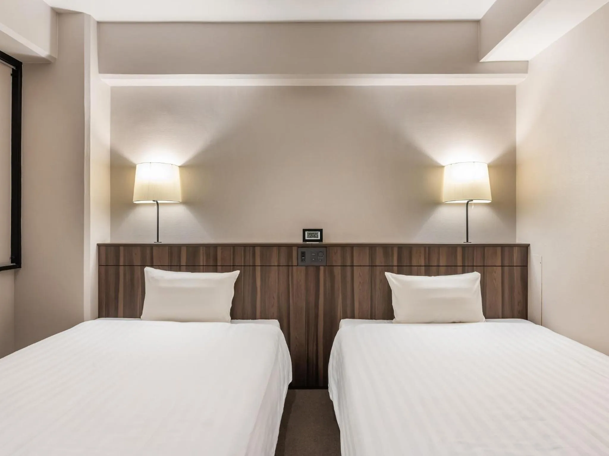 Photo of the whole room, Bed in Sunhotel Fukuyama