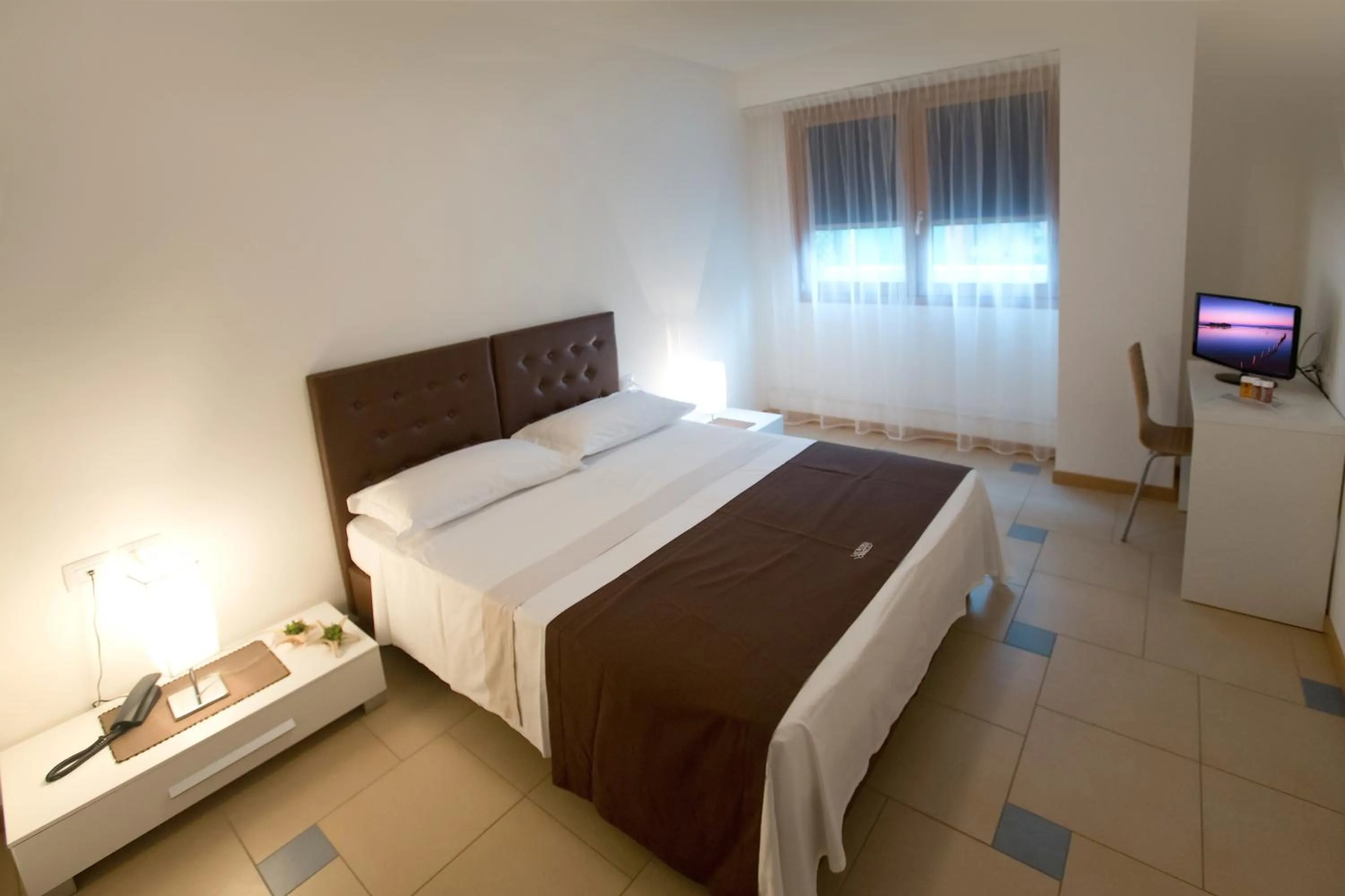 Bed in Lacroma Aparthotel