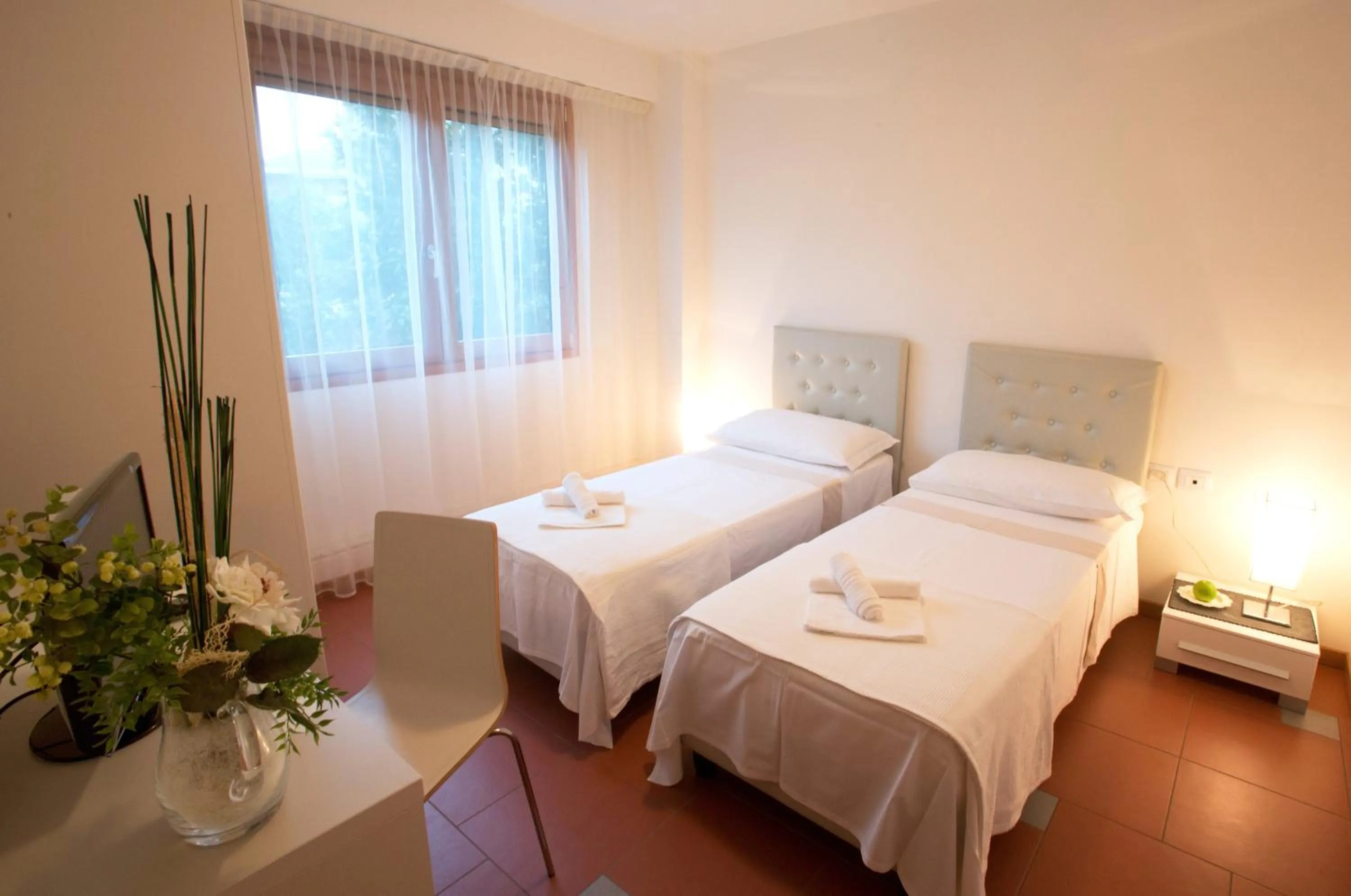 Bed in Lacroma Aparthotel