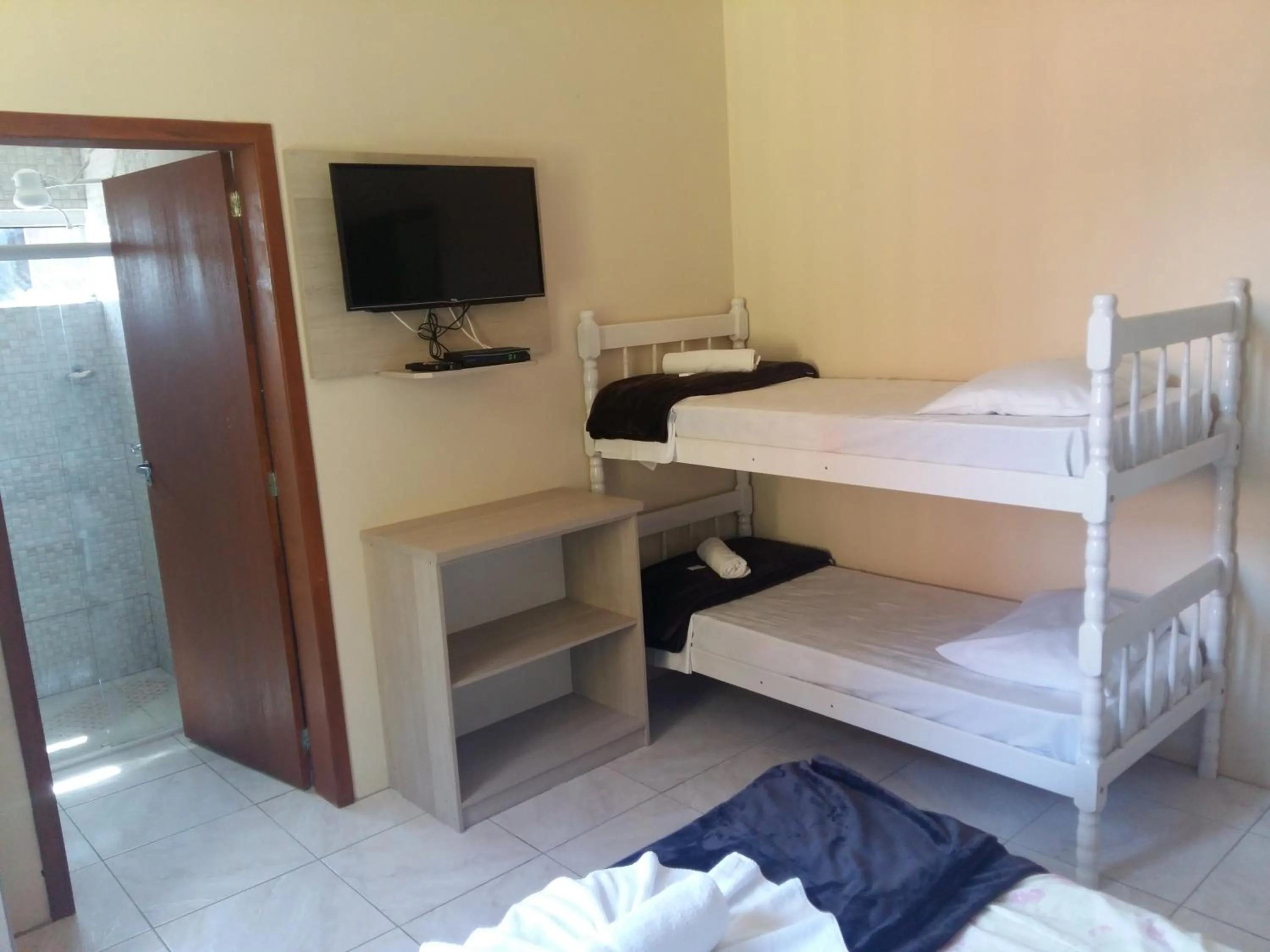 Communal lounge/ TV room, Bed in Hotel Rochamar