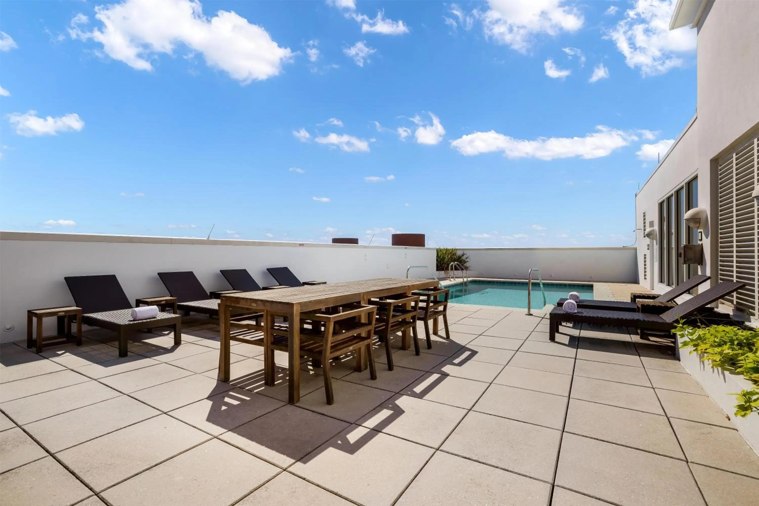 Pool view in The Banyan Hotel Fort Myers, Tapestry Collection by Hilton