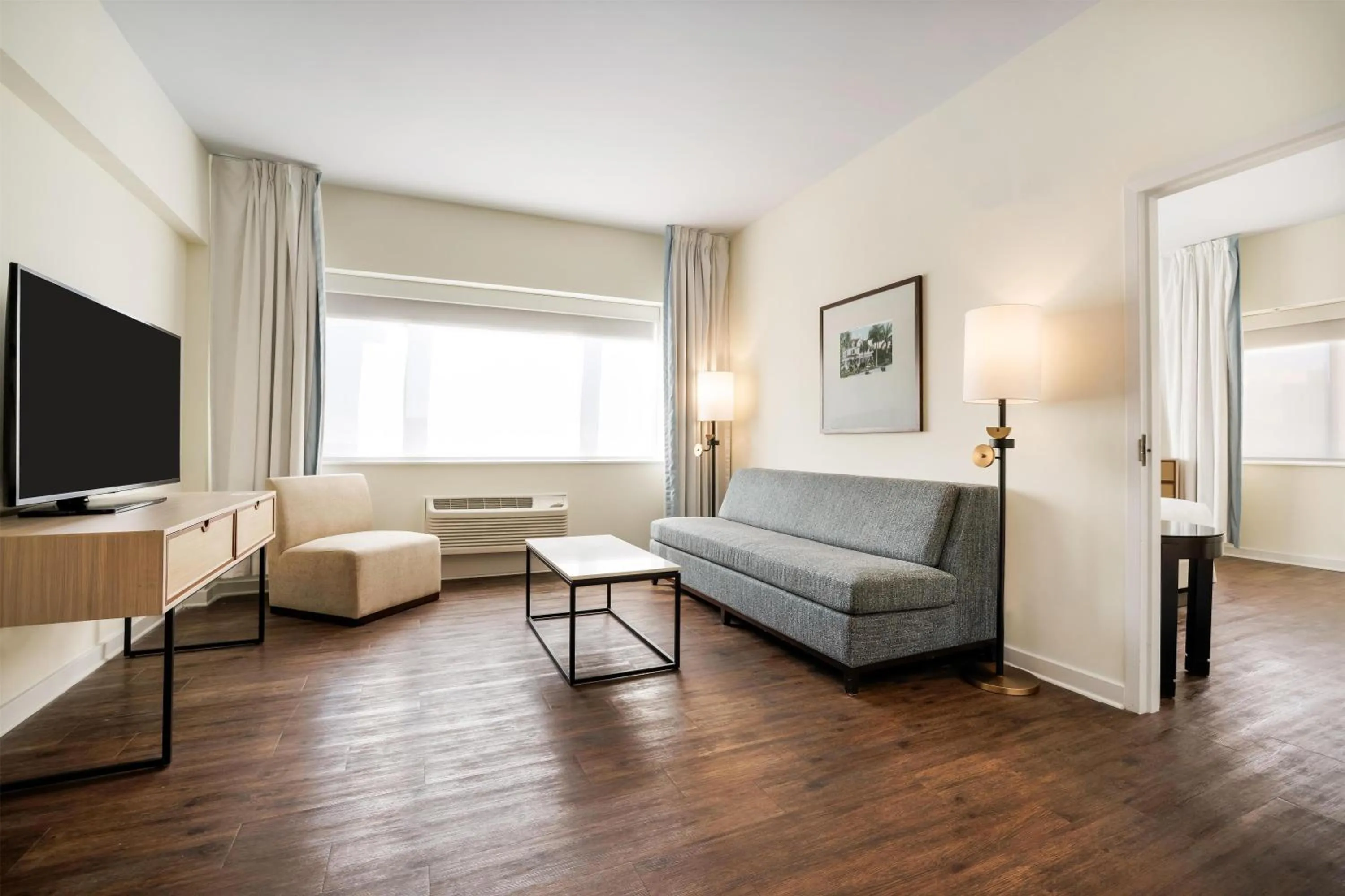 Living room, Bed in The Banyan Hotel Fort Myers, Tapestry Collection by Hilton