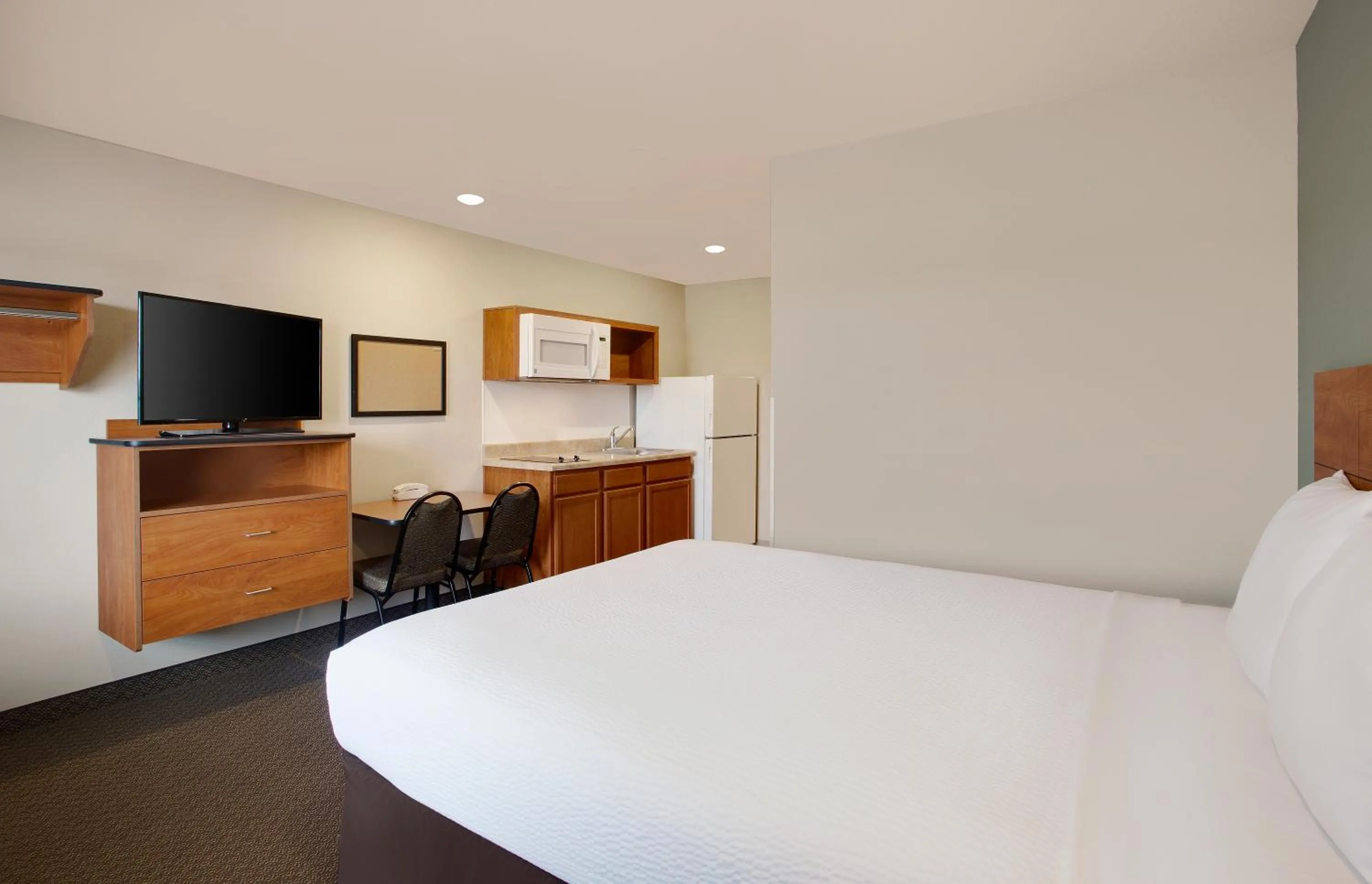 Bed in WoodSpring Suites Fredericksburg