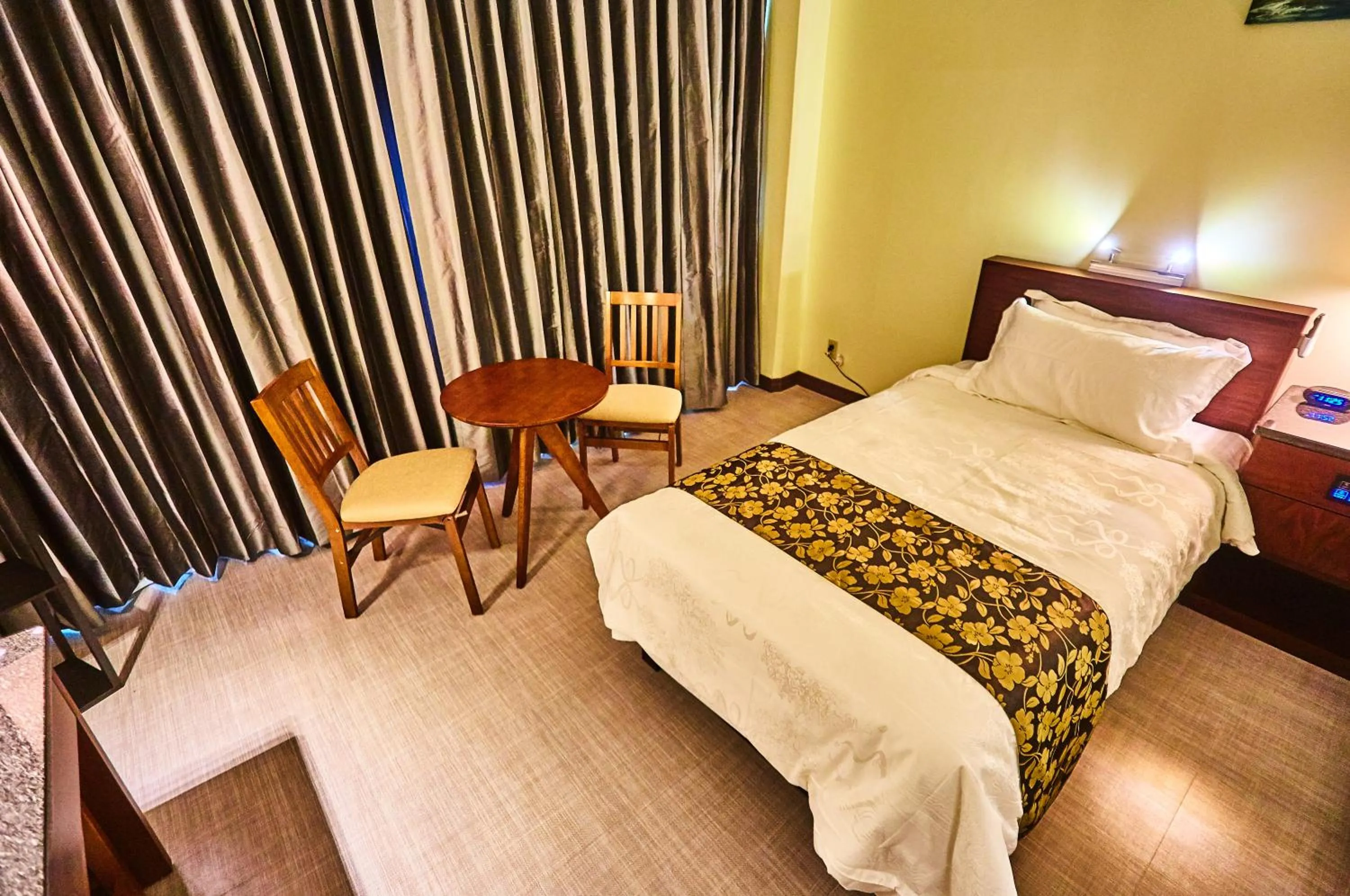Photo of the whole room, Bed in Serenti Hotel Saipan