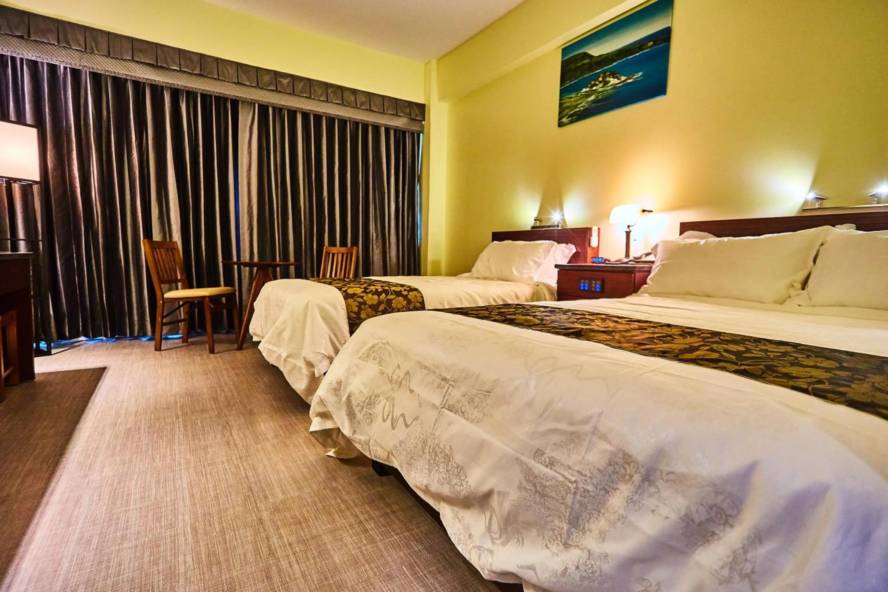 Photo of the whole room, Bed in Serenti Hotel Saipan