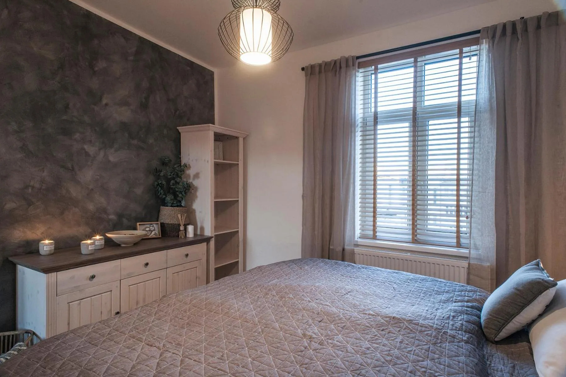 Bed in STING Boutique Apartments