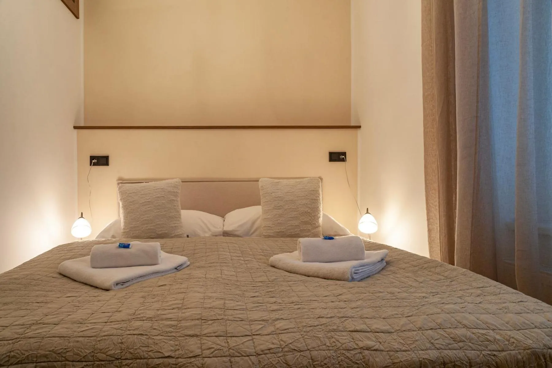 Bed in STING Boutique Apartments