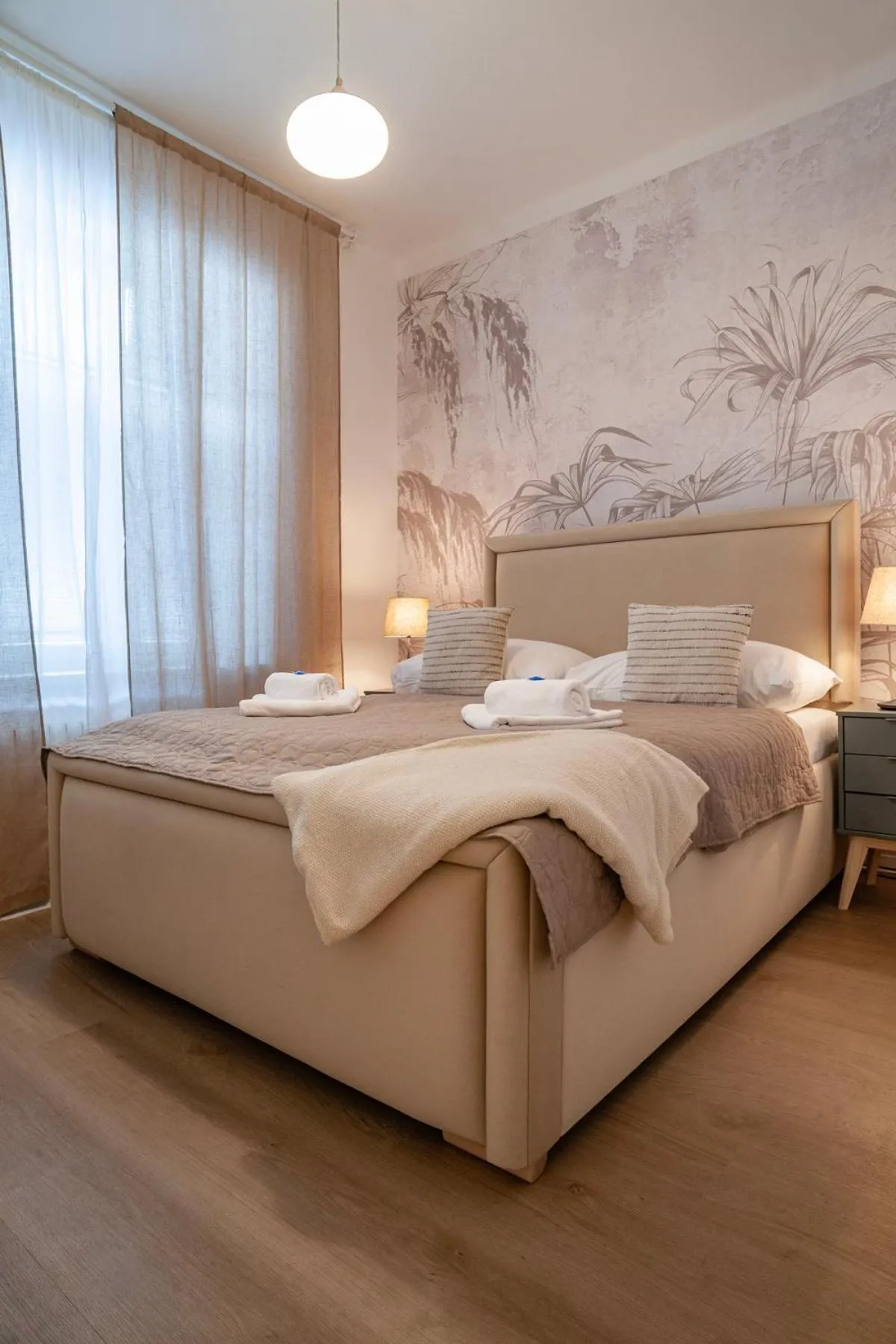 Bed in STING Boutique Apartments