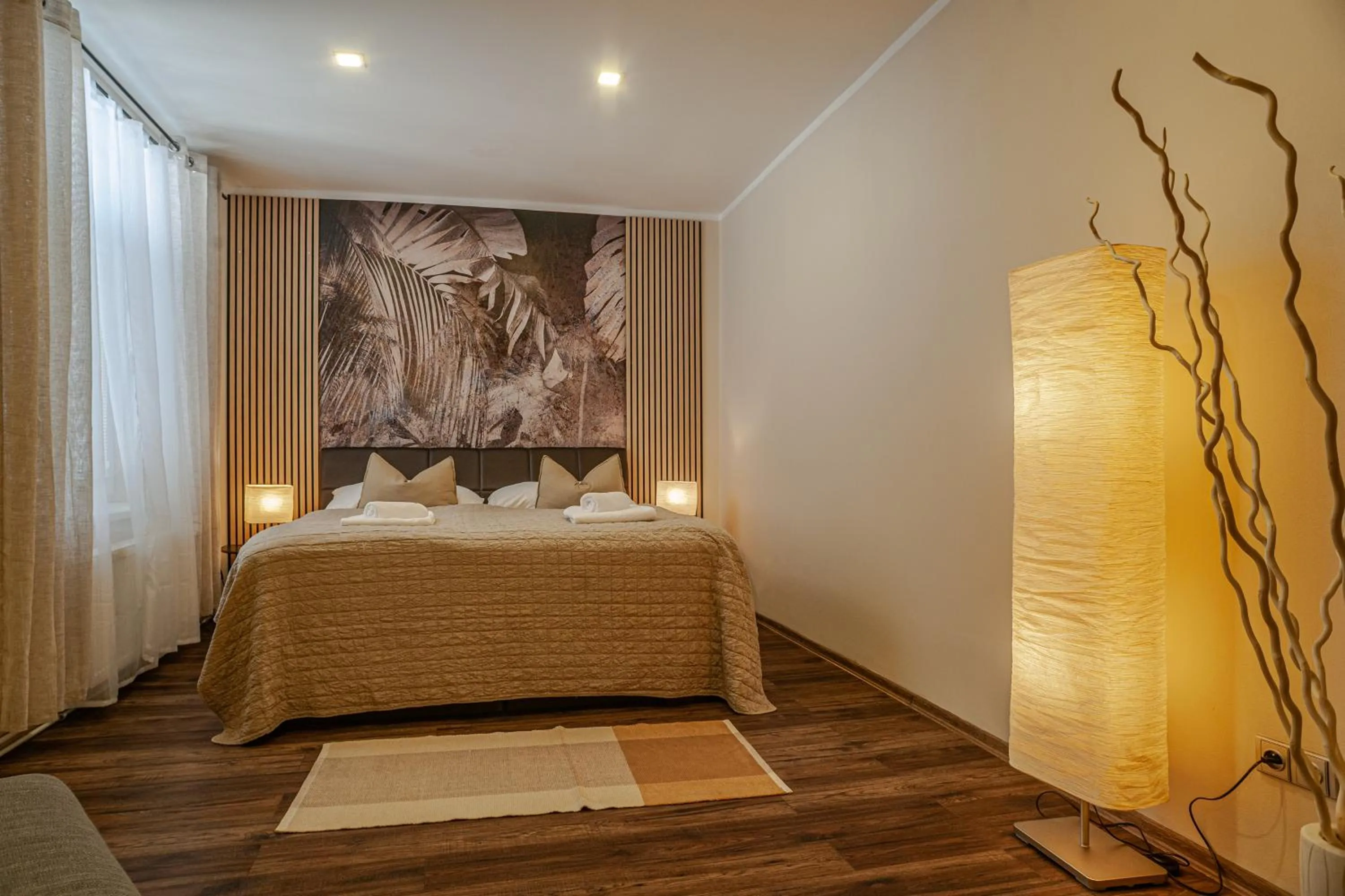 Bed in STING Boutique Apartments