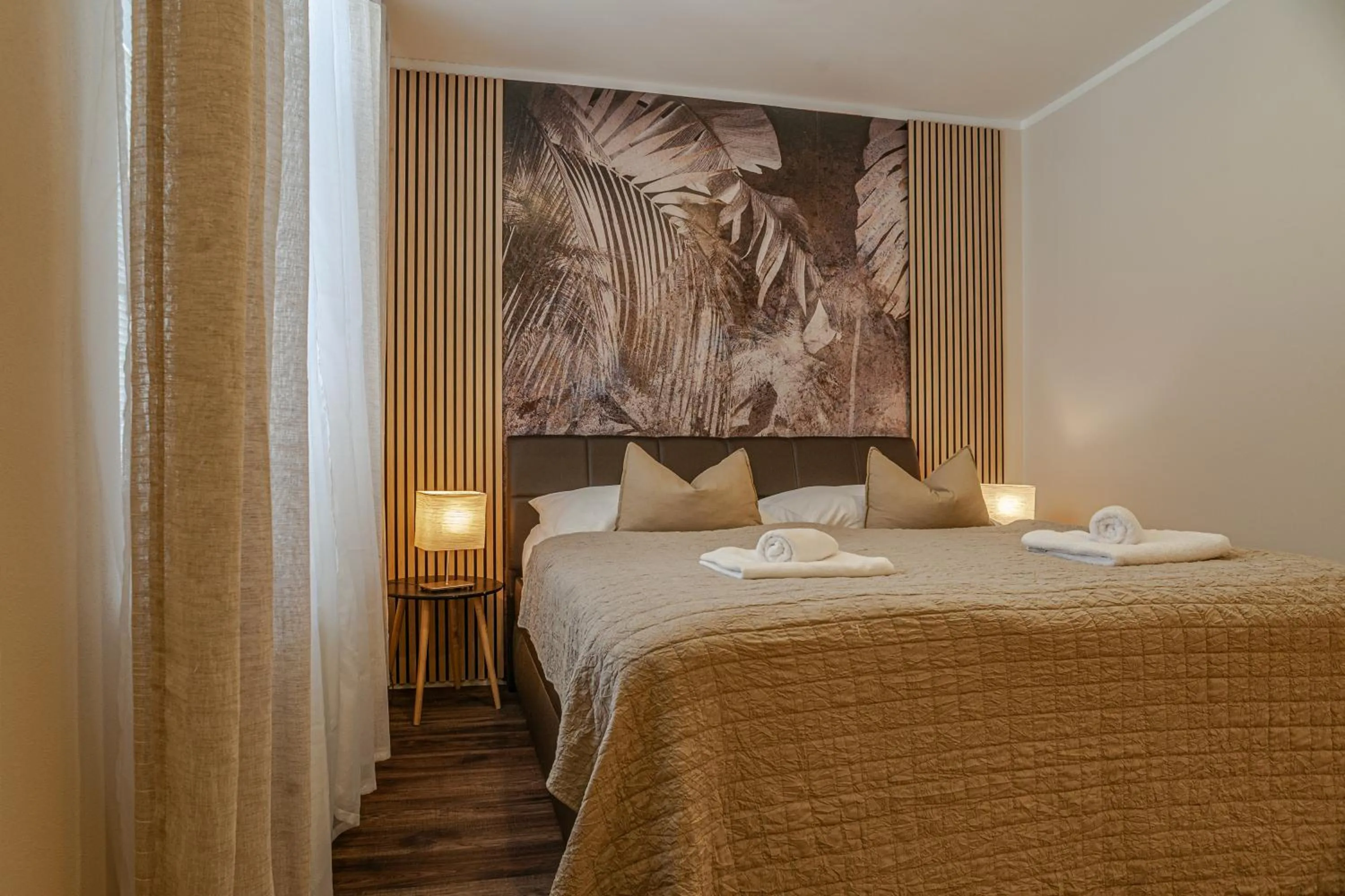 Bed in STING Boutique Apartments