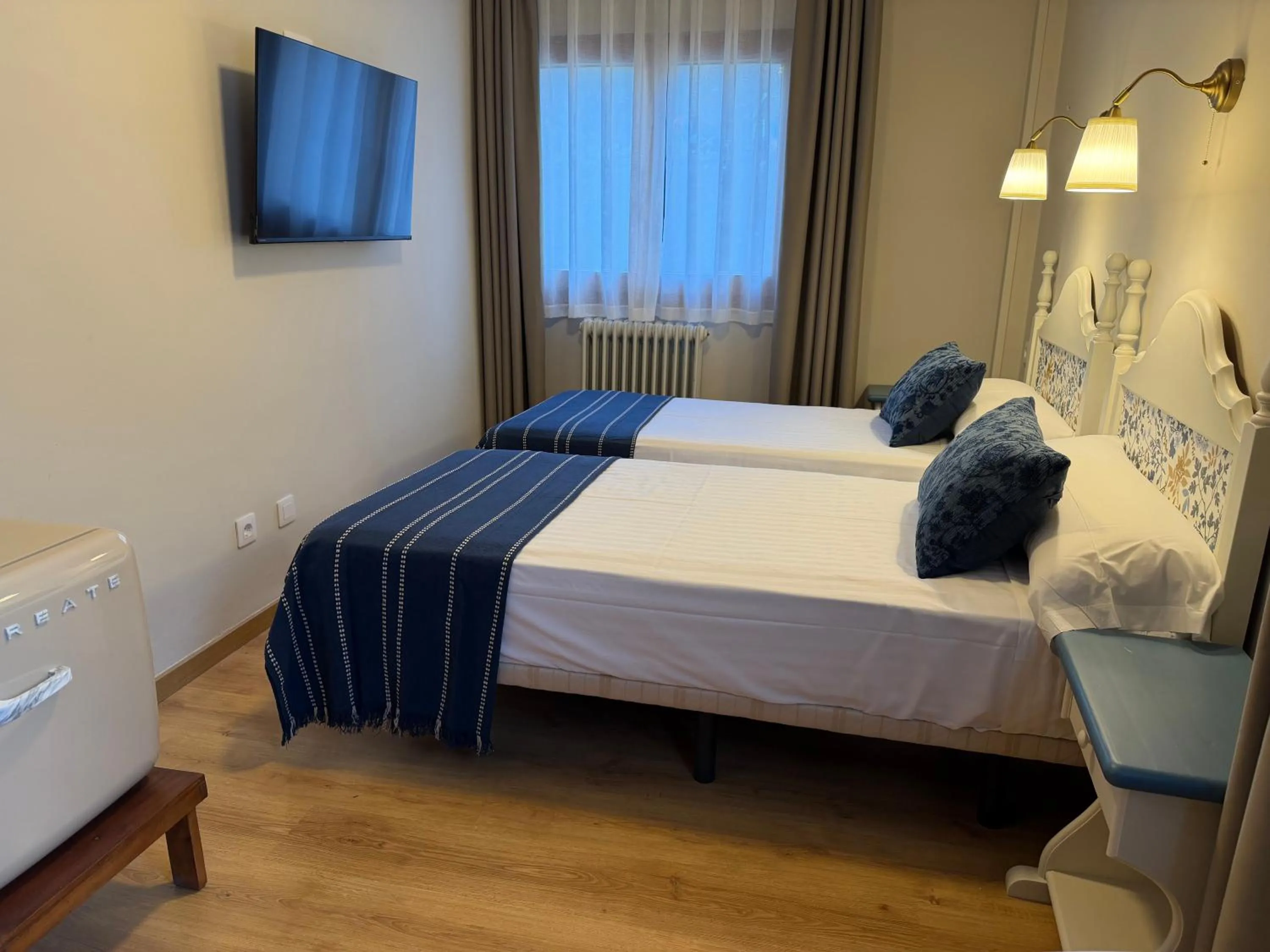 Bed in Edelweiss Hotel