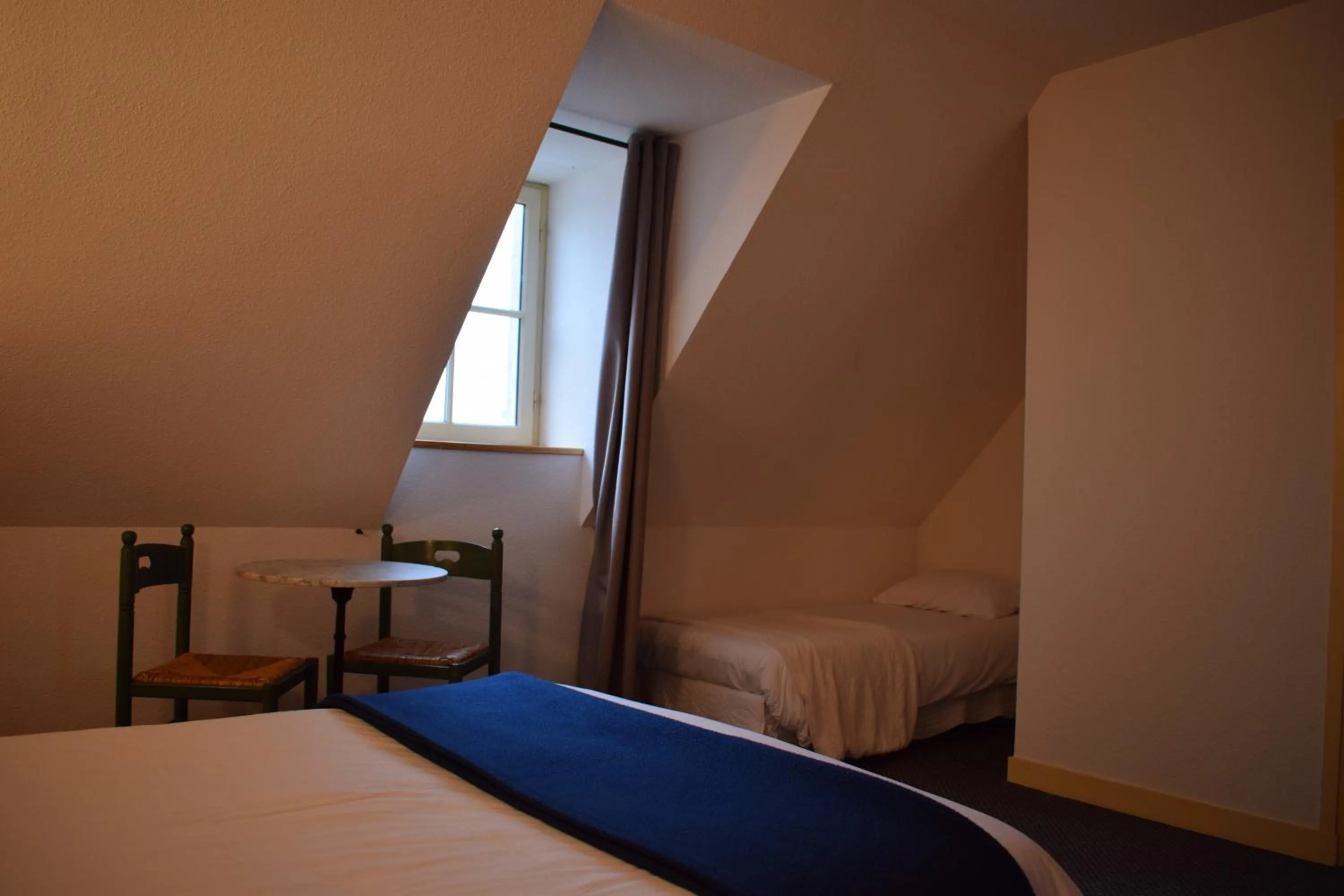 Photo of the whole room, Bed in Hôtel de France