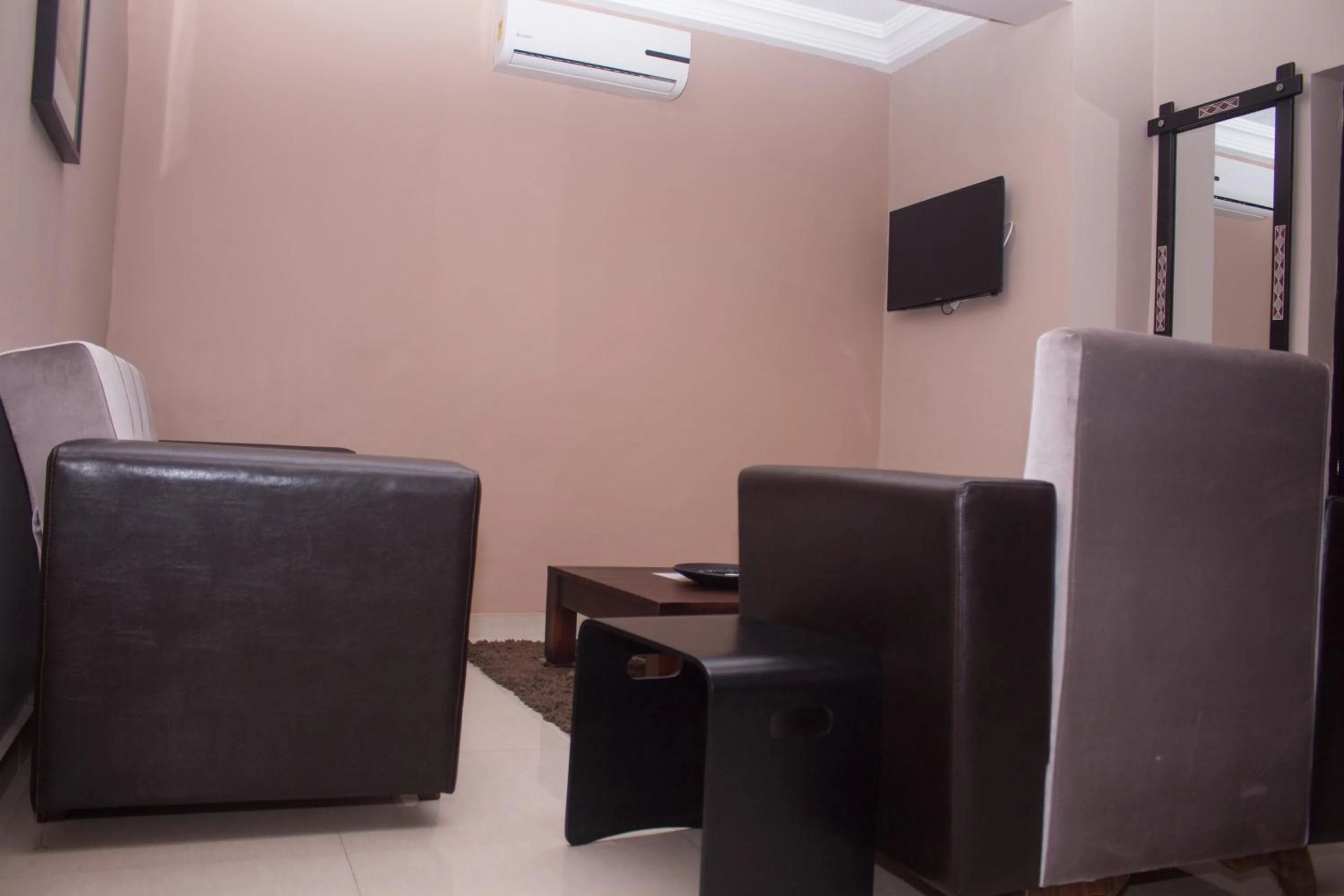Communal lounge/ TV room in Manjaro Suites