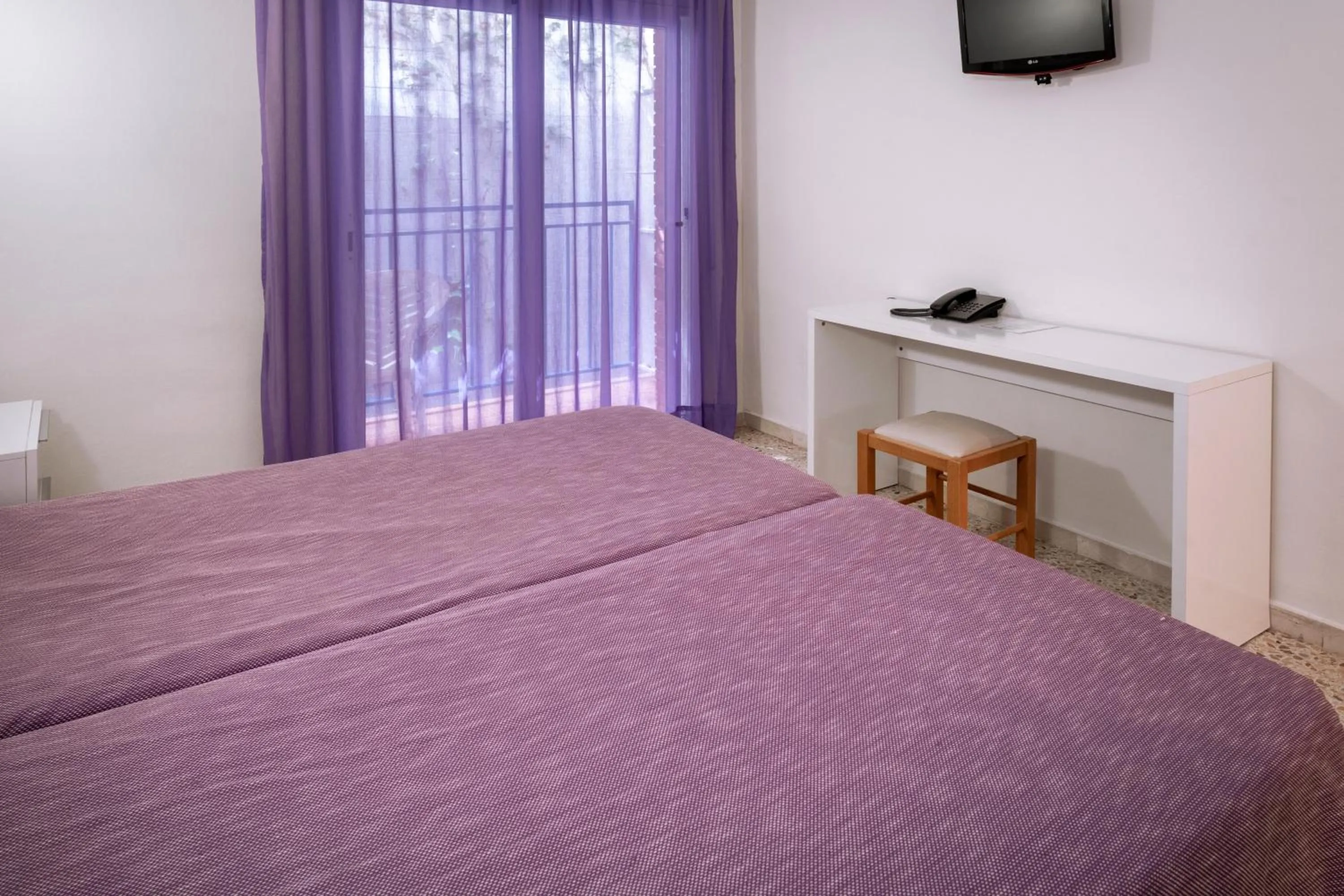 Photo of the whole room, TV/Entertainment Center in Moremar Hotel