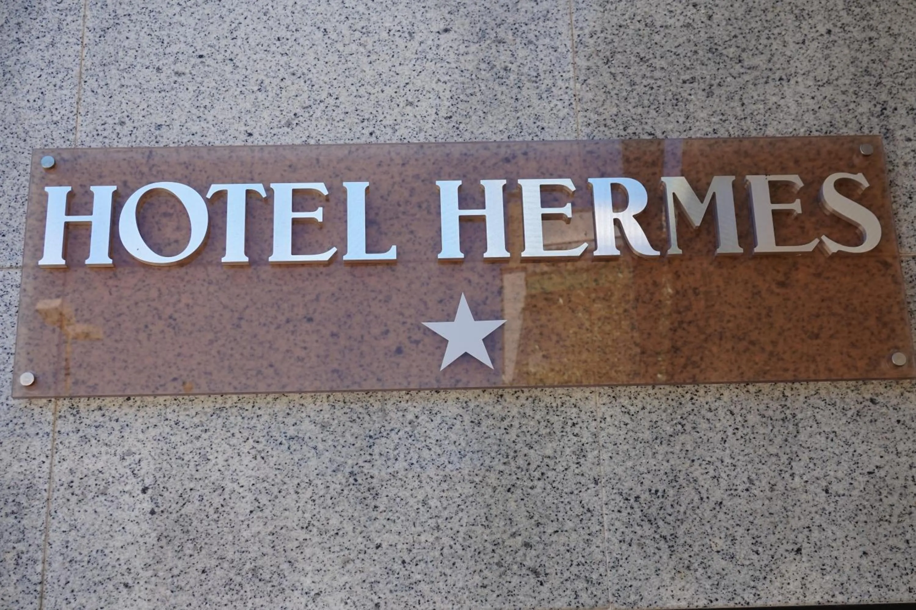 Property logo or sign in Hotel Hermes