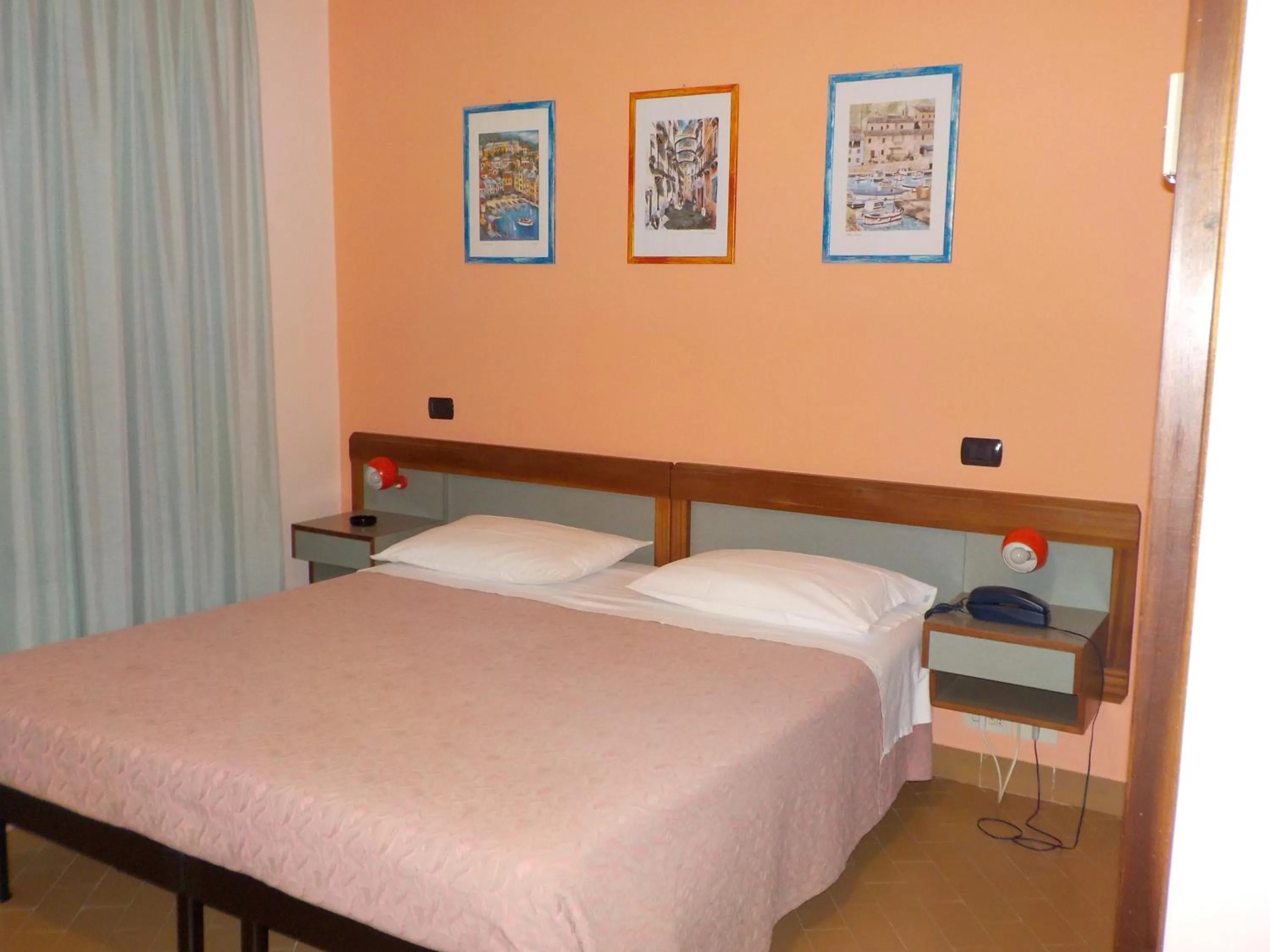 Bed in Hotel Le Pleiadi