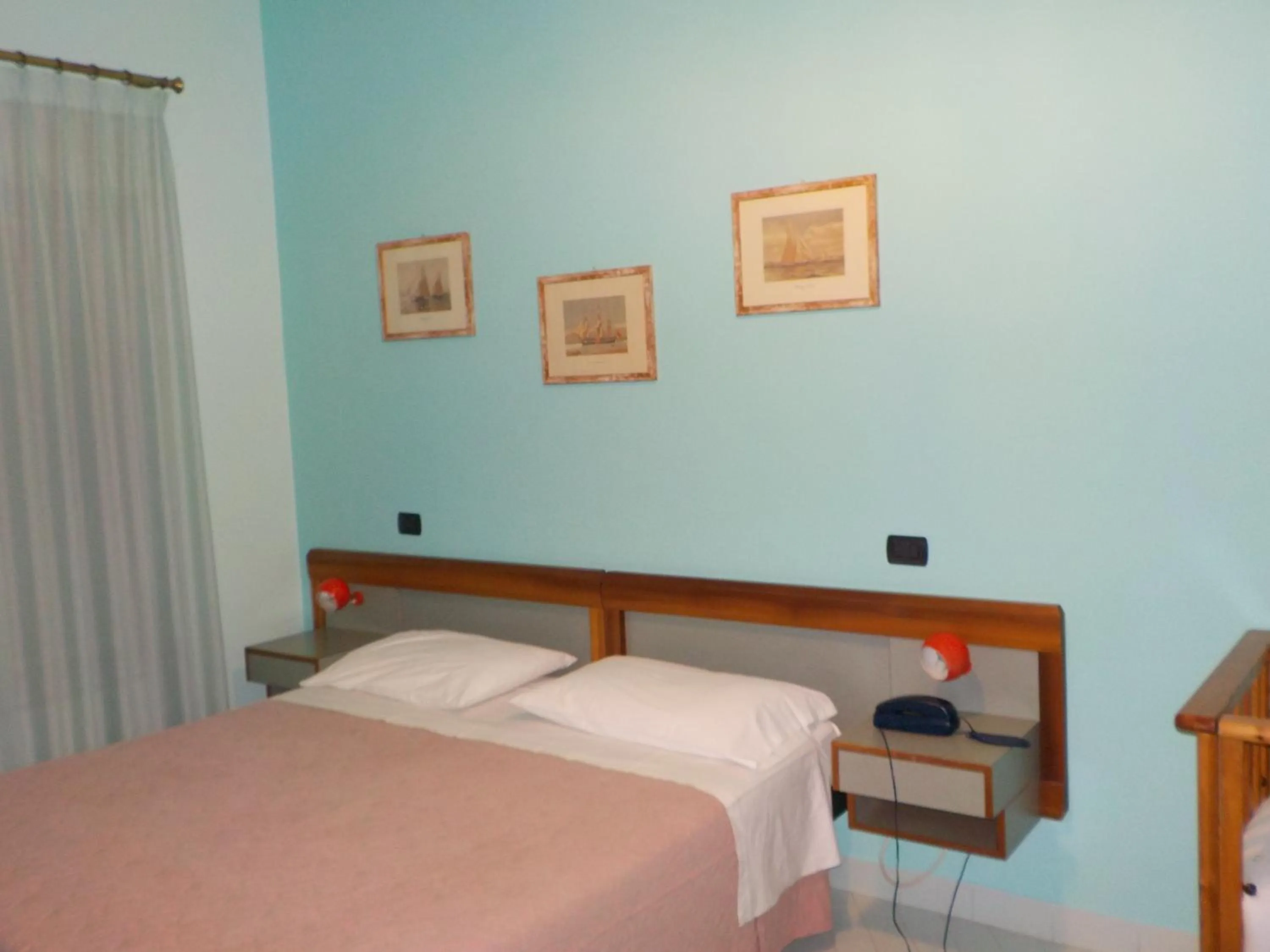 Bed in Hotel Le Pleiadi