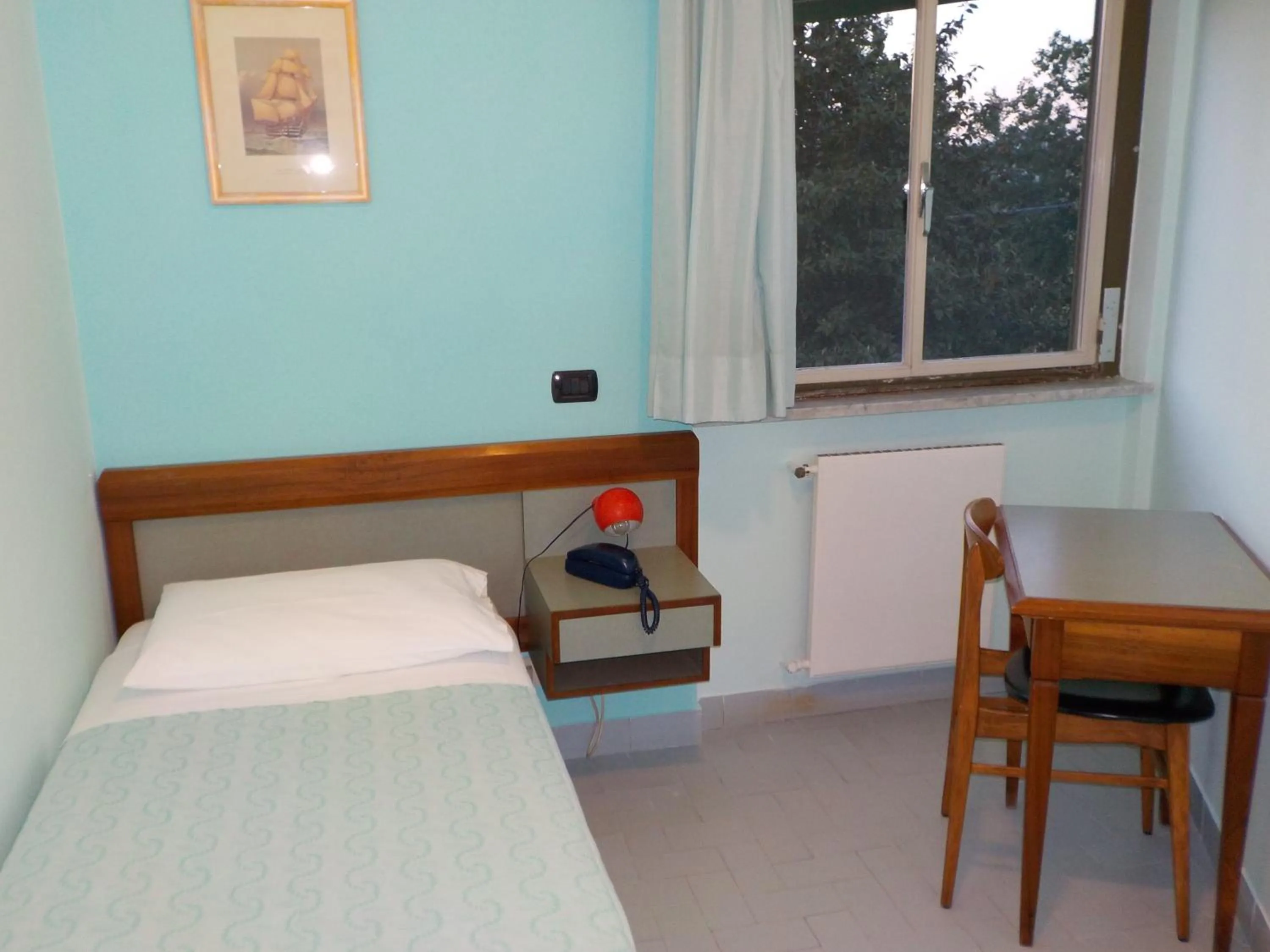 Bed in Hotel Le Pleiadi