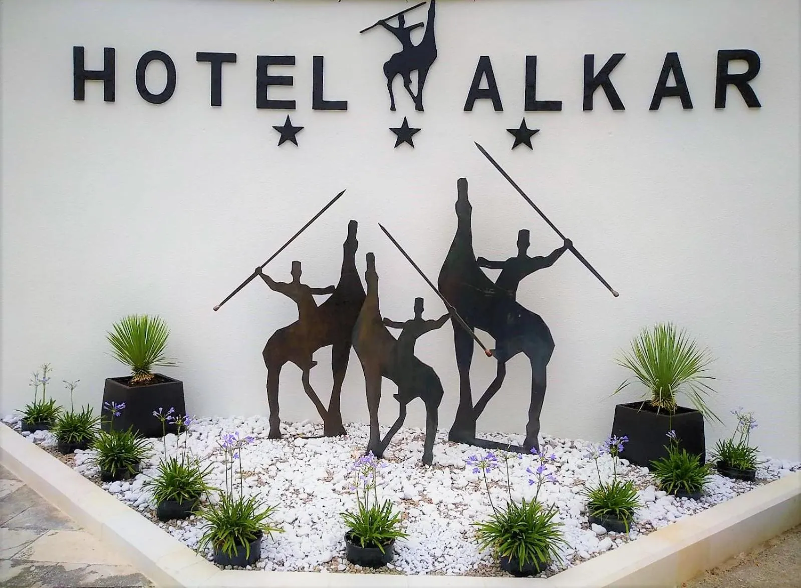 Property logo or sign in Hotel Alkar