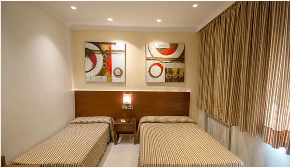 Bed in Hostal Atocha Almudena Martín