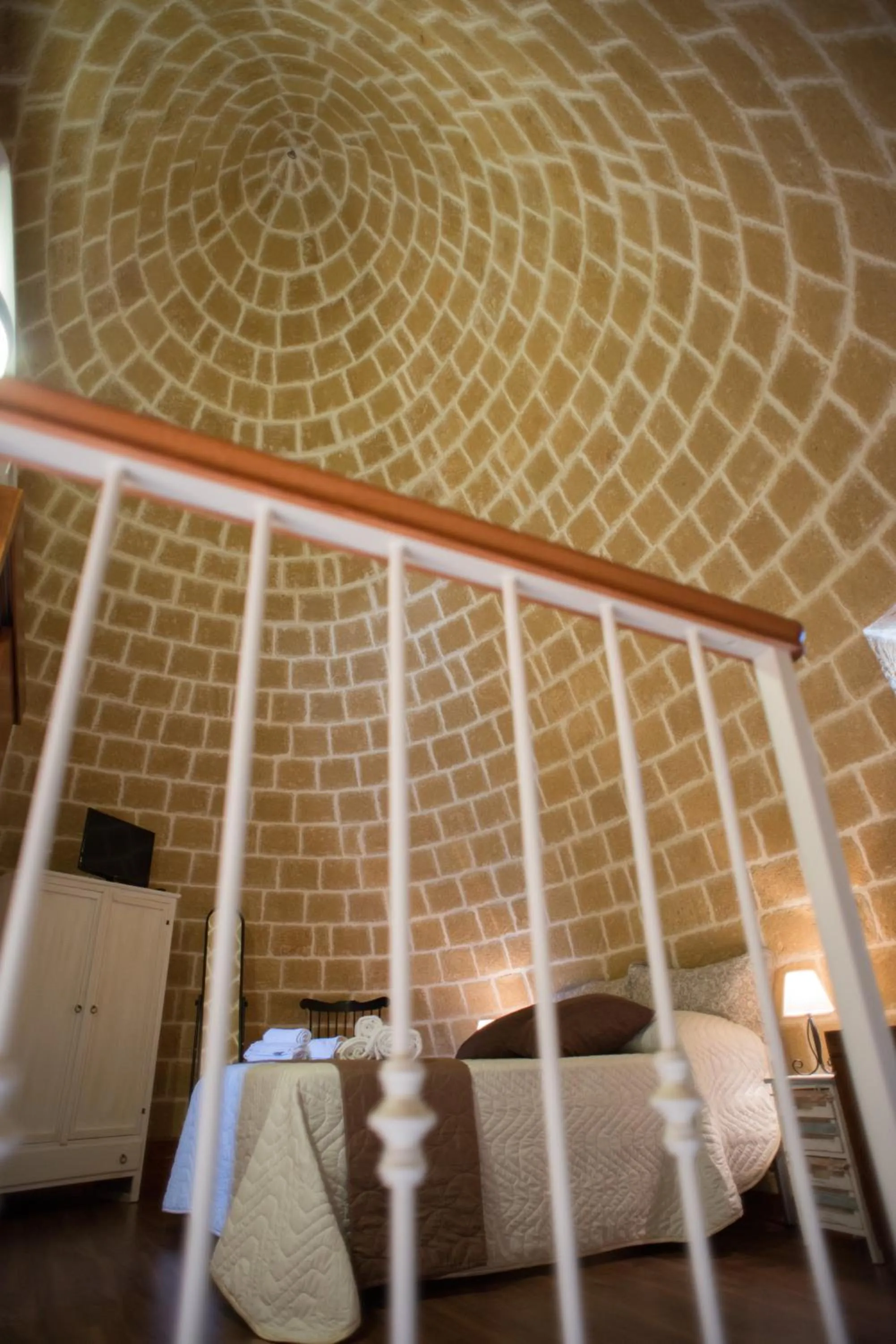 Bed in Grandi Trulli Bed & Breakfast