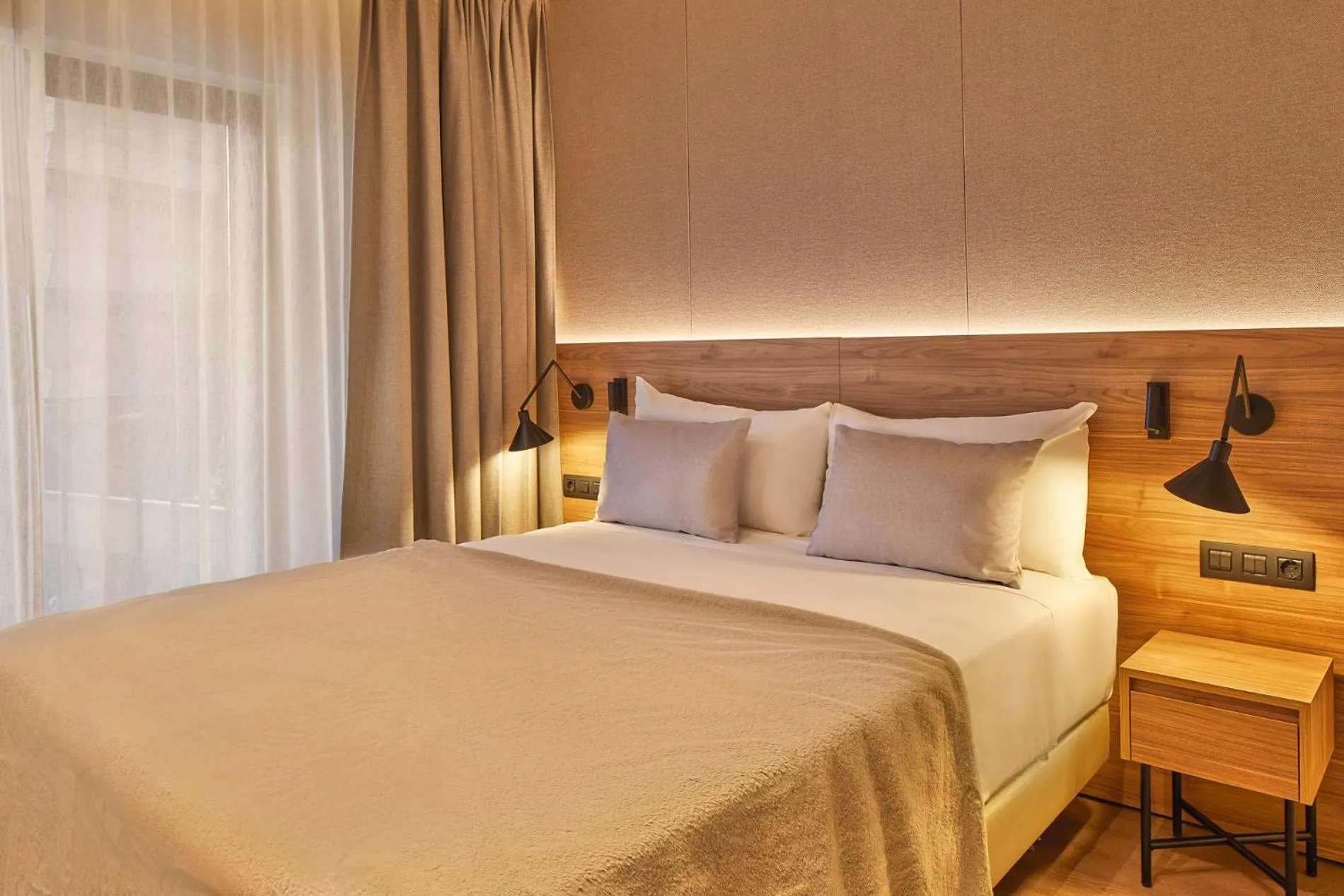 Bed in Hotel MIM Baqueira Luxury & SPA