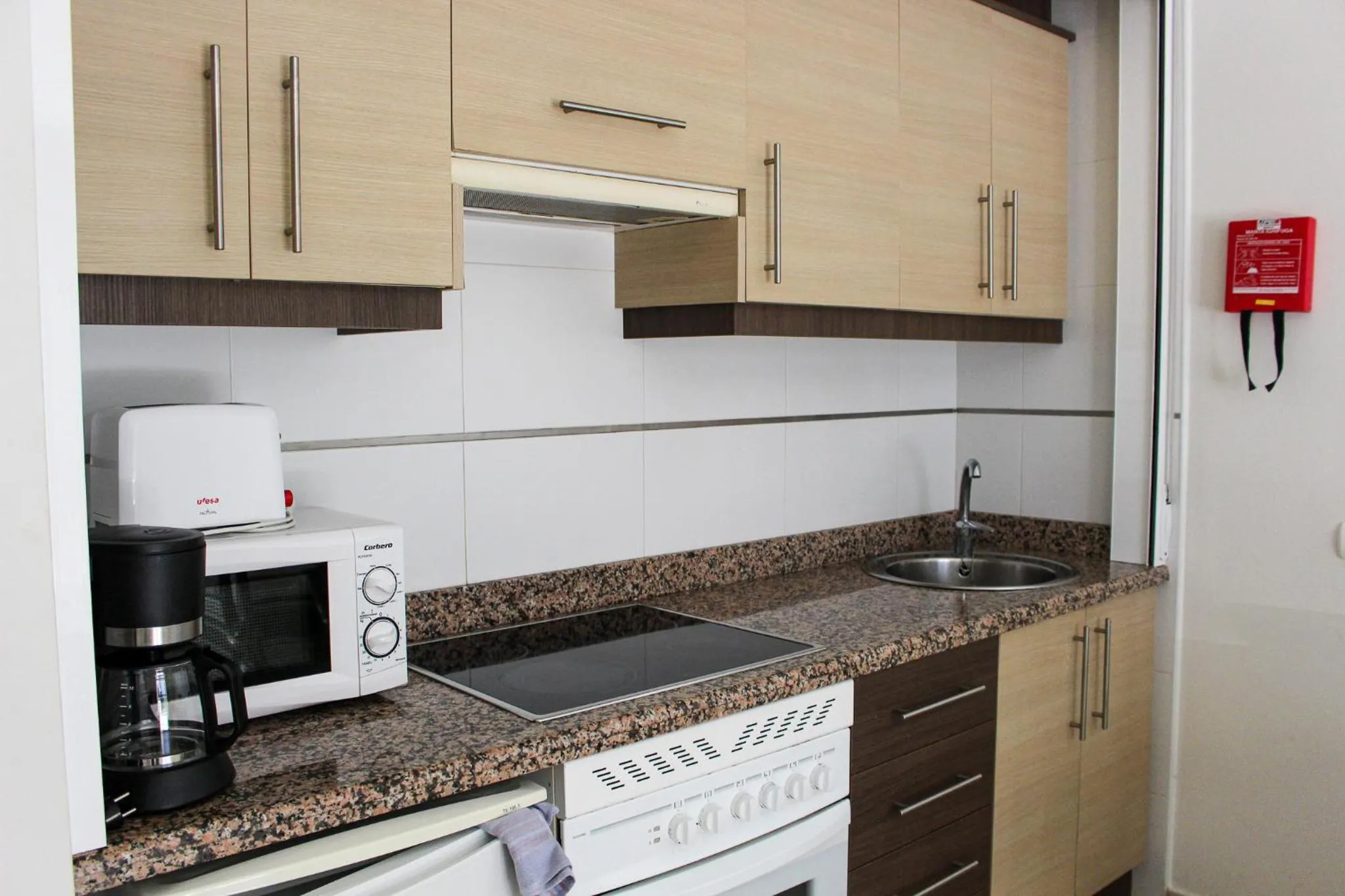 Kitchen or kitchenette in Apartamentos Larimar Unitursa