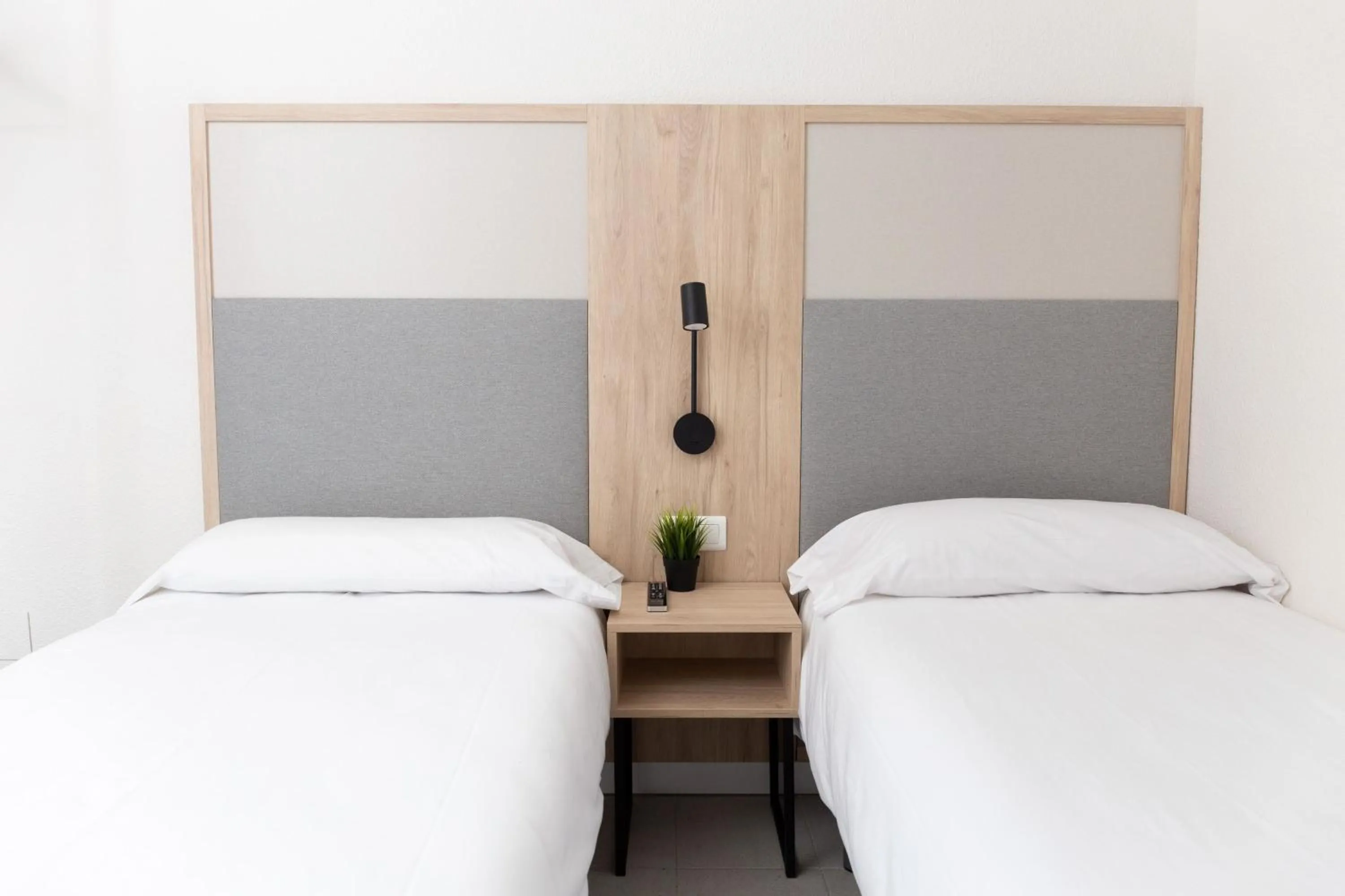 Bed in Dynastic Rooms Apartments